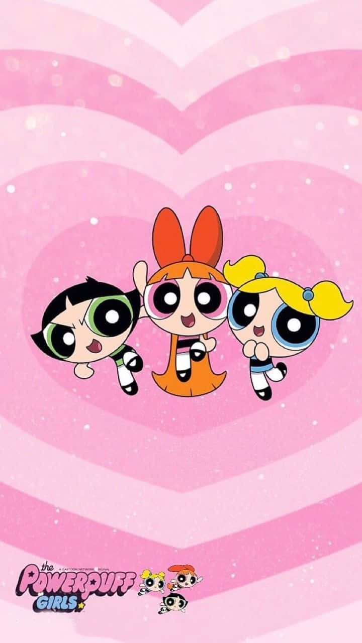 Powerpuff Girls Aesthetic 桌布 壁紙 — 三個大眼睛紮辮子的卡通女孩在粉紅色心形圖案背景上快樂地漂浮。