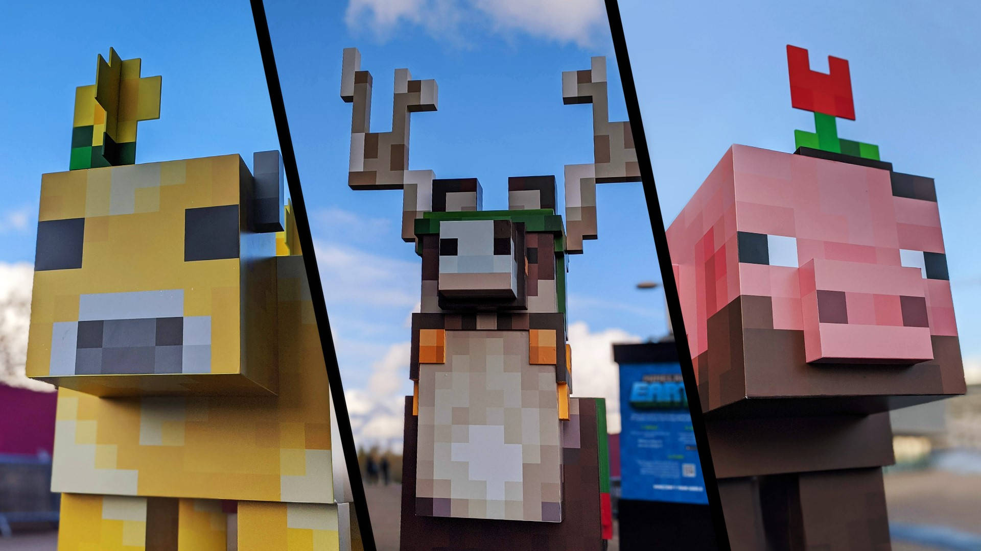 Minecraft Landscape 桌布 壁紙 — 三個巨大的像素化Minecraft角色：一隻黃牛、一隻鹿和一隻豬，並排站在明亮的藍天下。