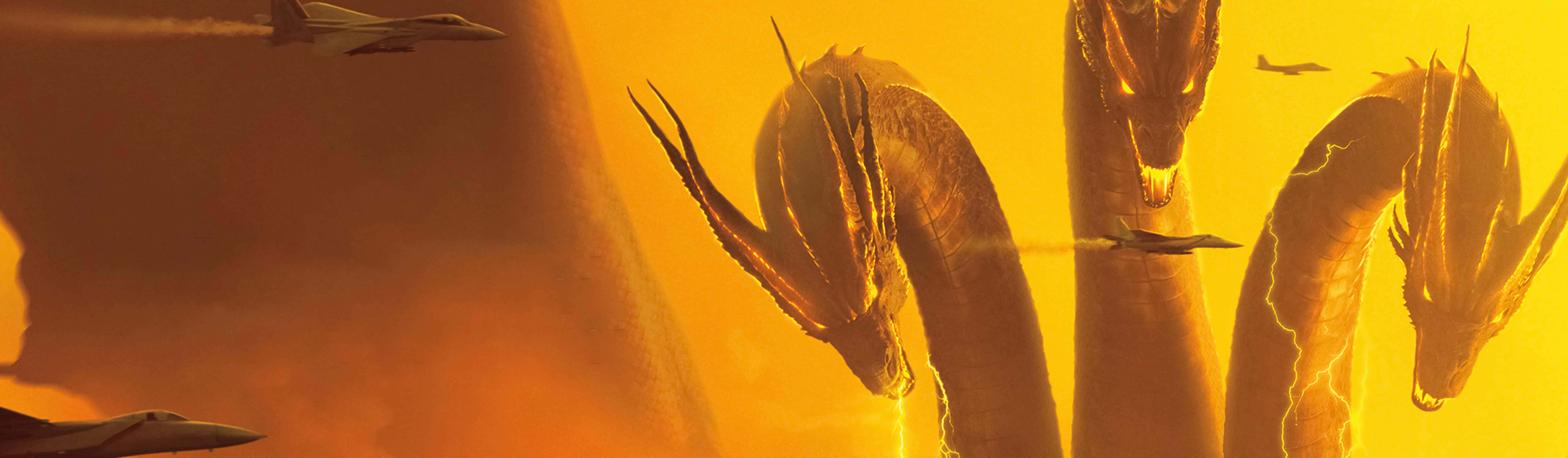 King Ghidorah 桌布 壁紙 — 三個巨大的龍頭從火橙色的雲層中出現，戰鬥機在戲劇性的空戰中飛過。