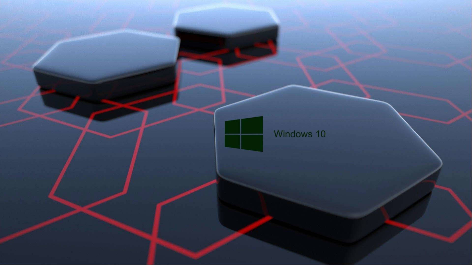 black windows 10 HD 桌布 壁紙 — 三個帶有 Windows 10 標誌的光澤六角形方塊放置在帶有發光紅色網格線的深色表面上。