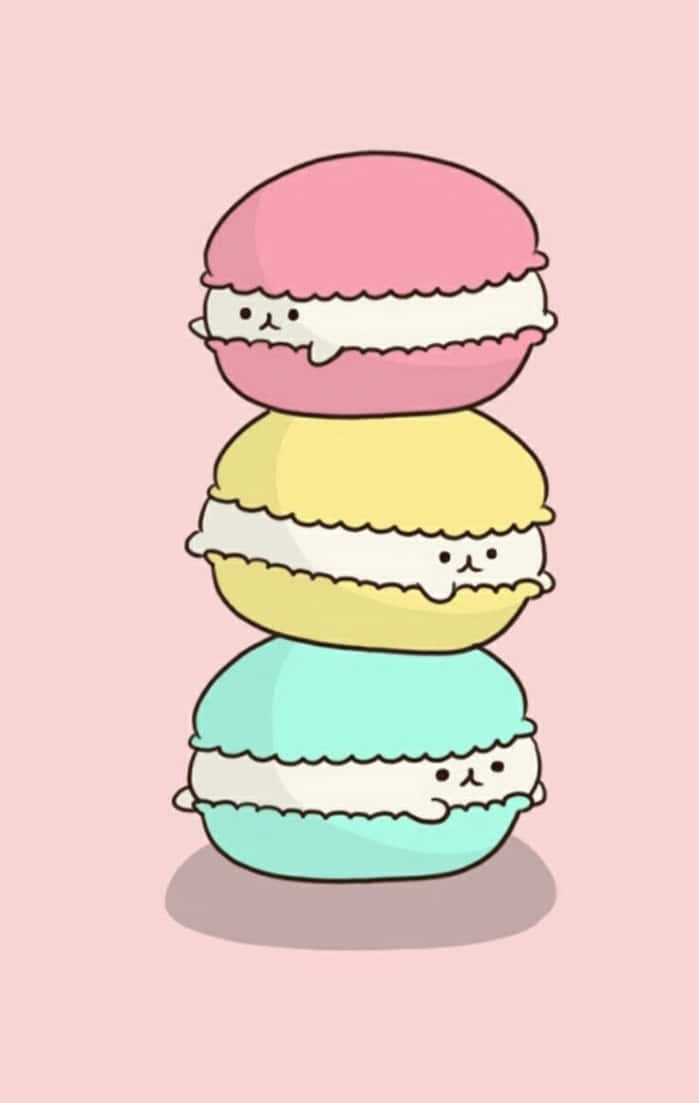 Cute Food iPhone 桌布 壁紙 — 三個帶有可愛臉孔的粉彩馬卡龍垂直堆疊在柔和的粉紅色背景上。