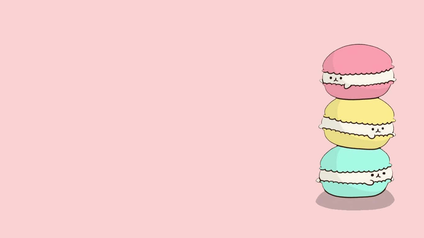 pusheen 動圖 桌布 壁紙 — 三個帶有可愛臉孔的粉彩馬卡龍堆疊在柔和的粉紅色背景上。