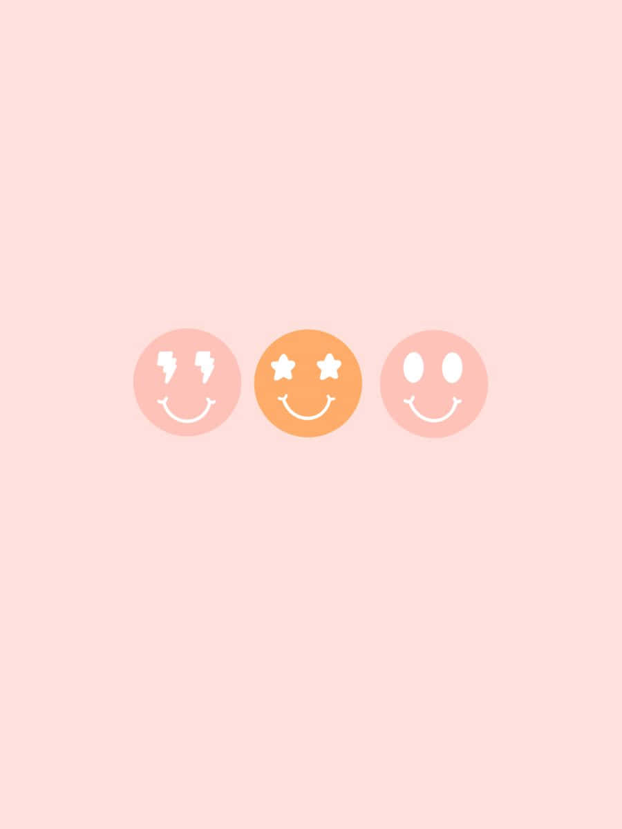 Smiley 桌布 壁紙 — 三個帶有閃電星星和普通眼睛的極簡笑臉漂浮在柔和的粉紅色背景上。