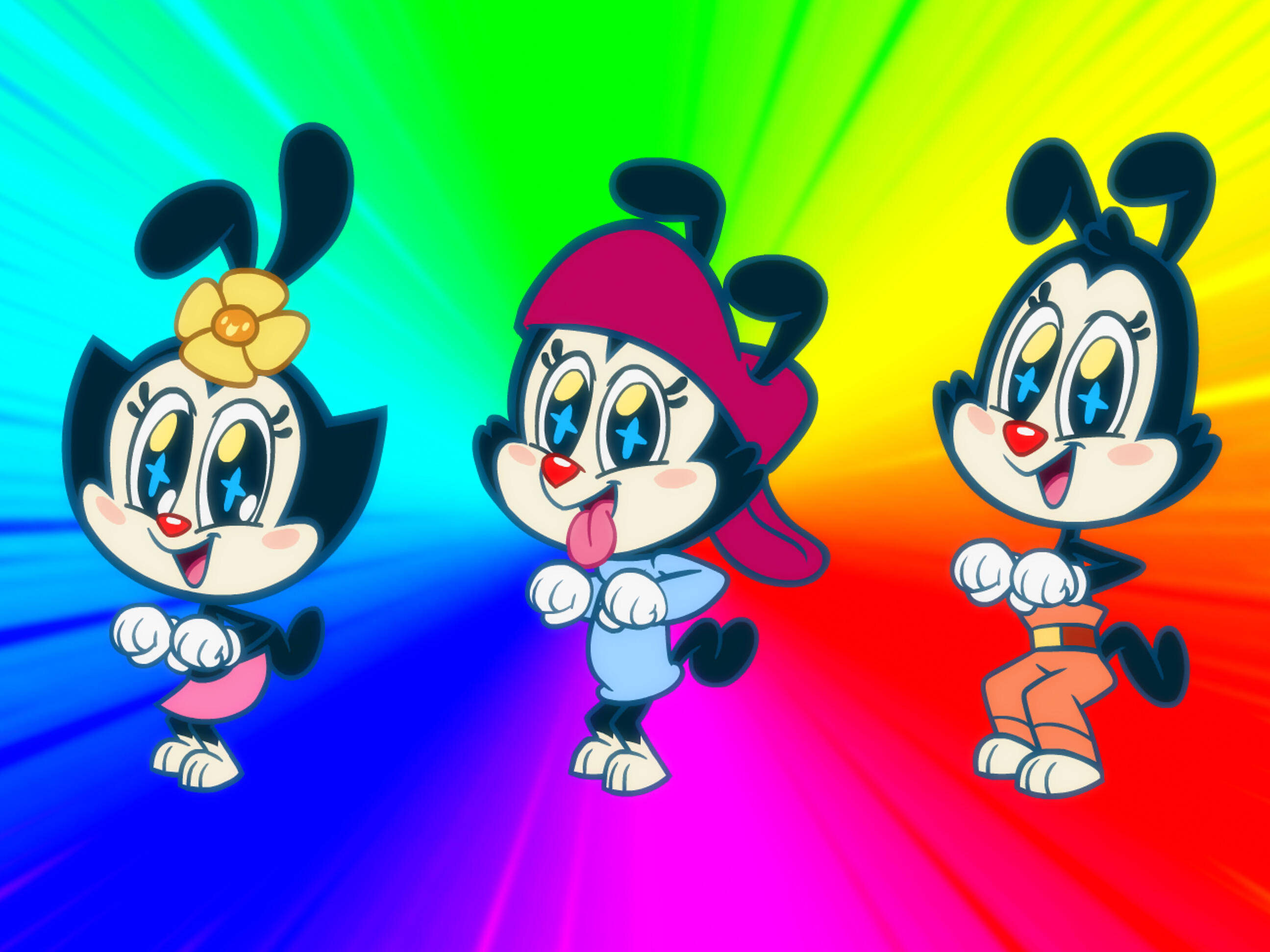 Animaniacs 桌布 壁紙 — 三個快樂的卡通角色，有黑色耳朵和星星眼睛，在燦爛的彩虹漸變背景前擺姿勢。