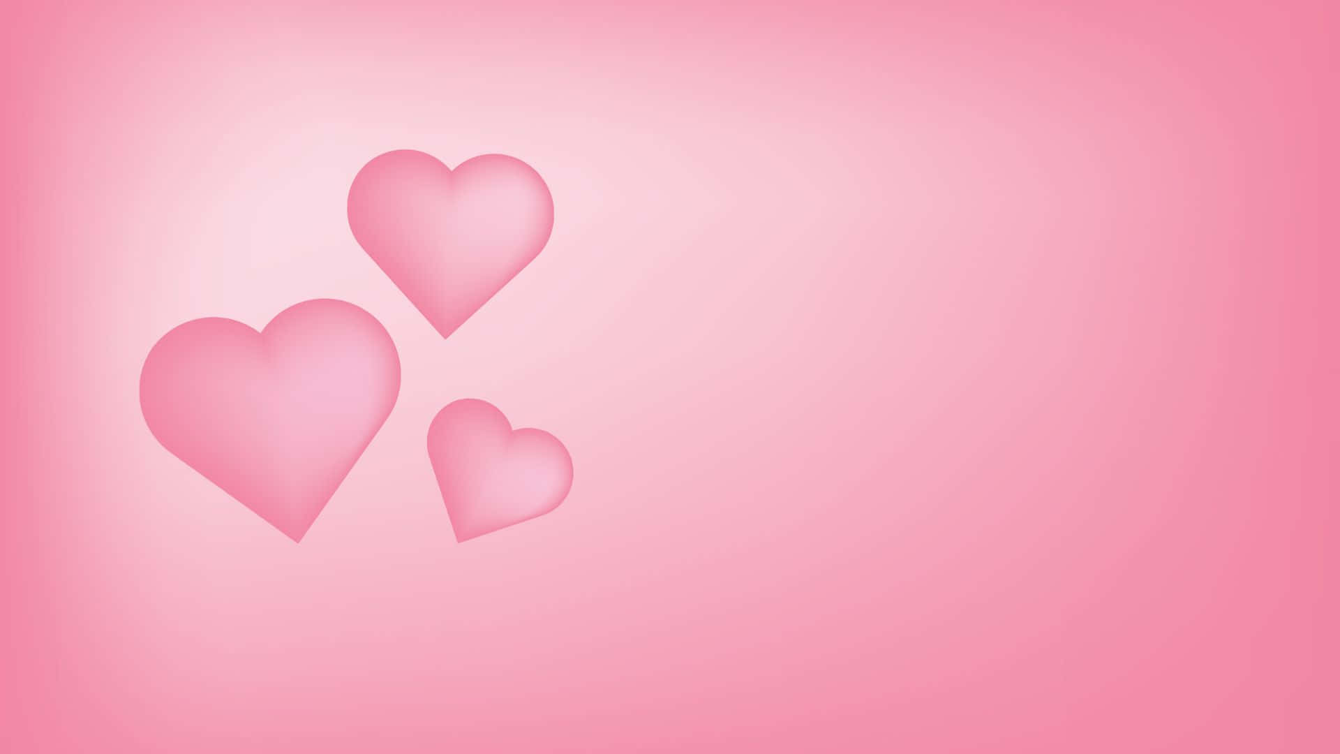 Pink Love 桌布 壁紙 — 三個柔和的粉紅色心形在漸變粉紅色背景上輕輕漂浮，帶有微妙的燈光效果。