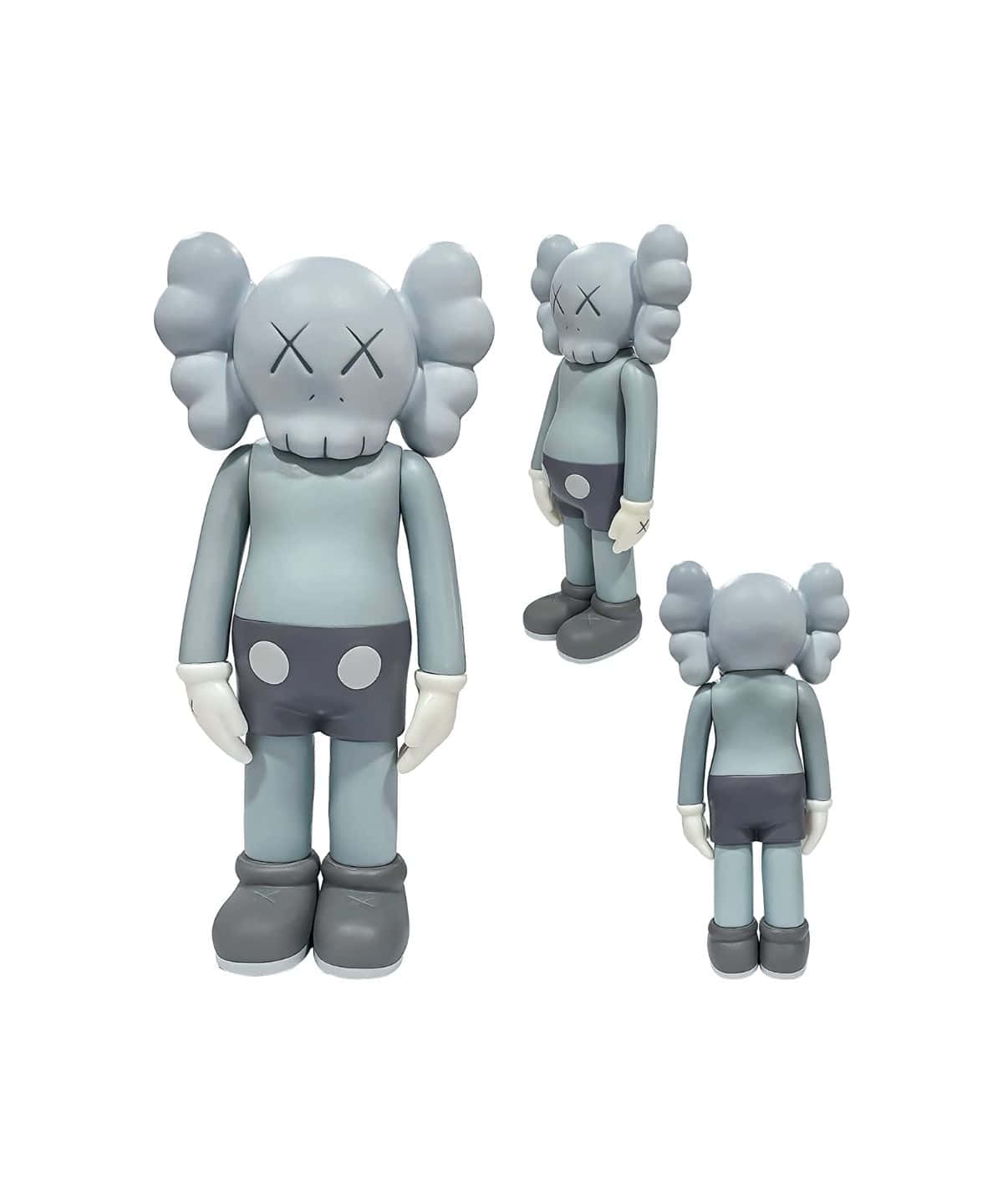 Kaws Figures 桌布 壁紙 — 三個灰色KAWS公仔以不同尺寸在純白背景前擺姿勢，展示其標誌性的X眼設計。