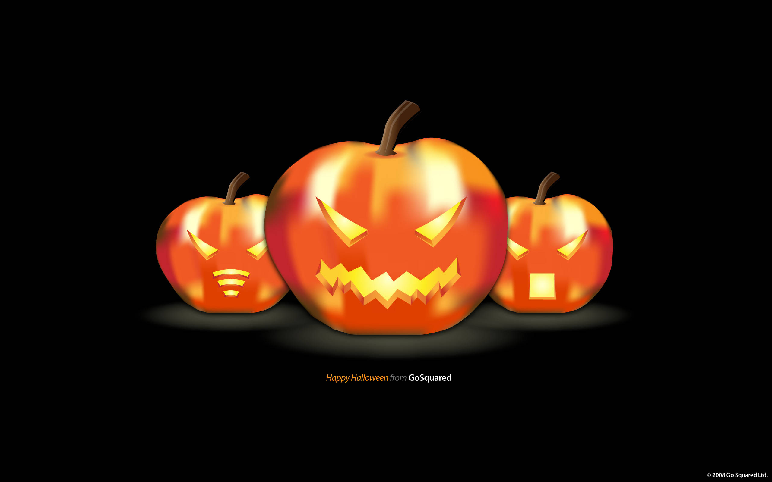 Halloween Pumpkin 桌布 壁紙 — 三個發光的傑克南瓜燈，帶有兇惡雕刻的臉孔，漂浮在純黑背景上。