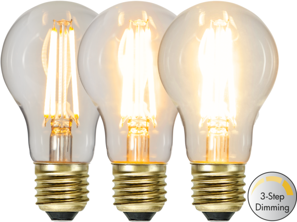 LED 桌布 壁紙 — 三個發光的復古風格LED燈絲燈泡，帶金色螺絲底座，黑色背景。