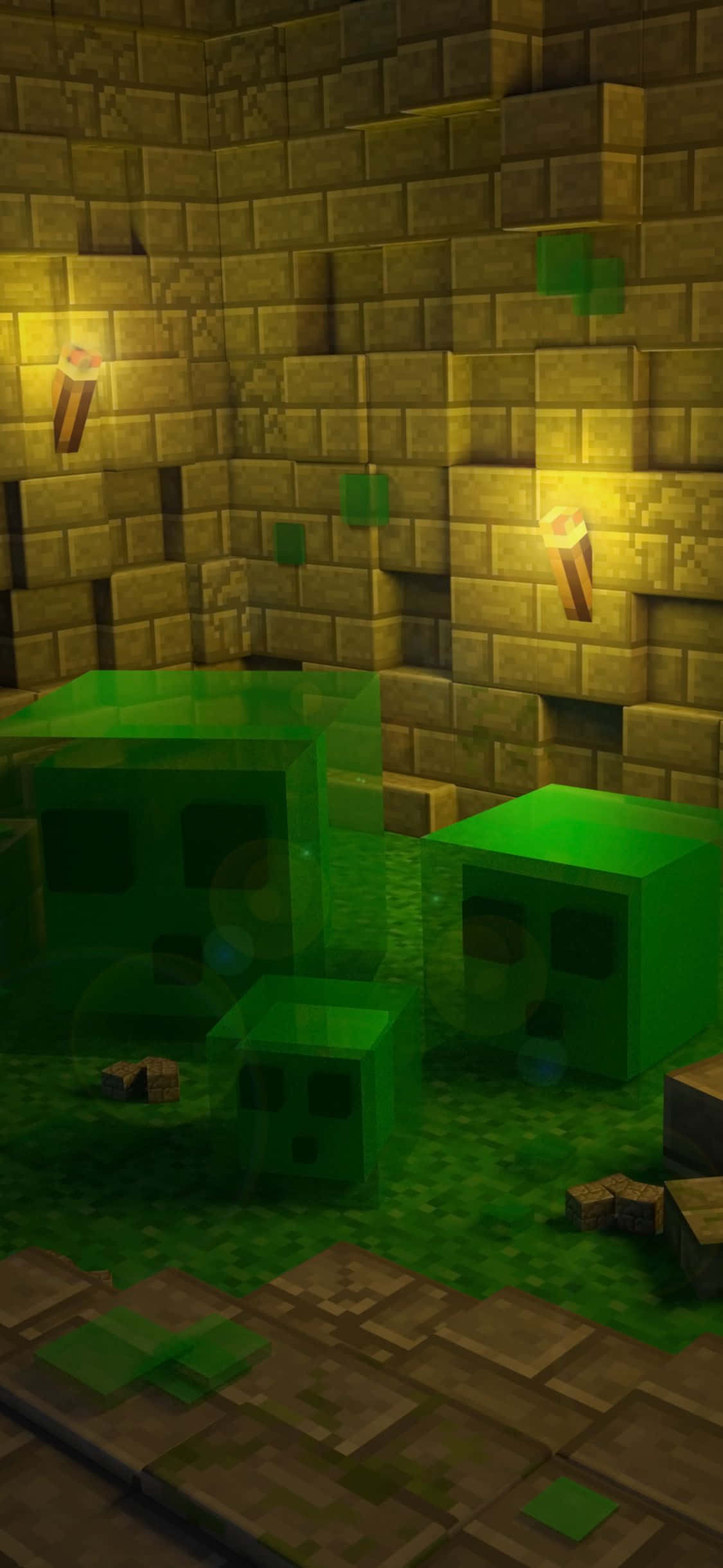 iPhone Xs Minecraft 桌布 壁紙 — 三個發光的綠色爬行者站在一個由火炬照亮的昏暗石頭地牢中。