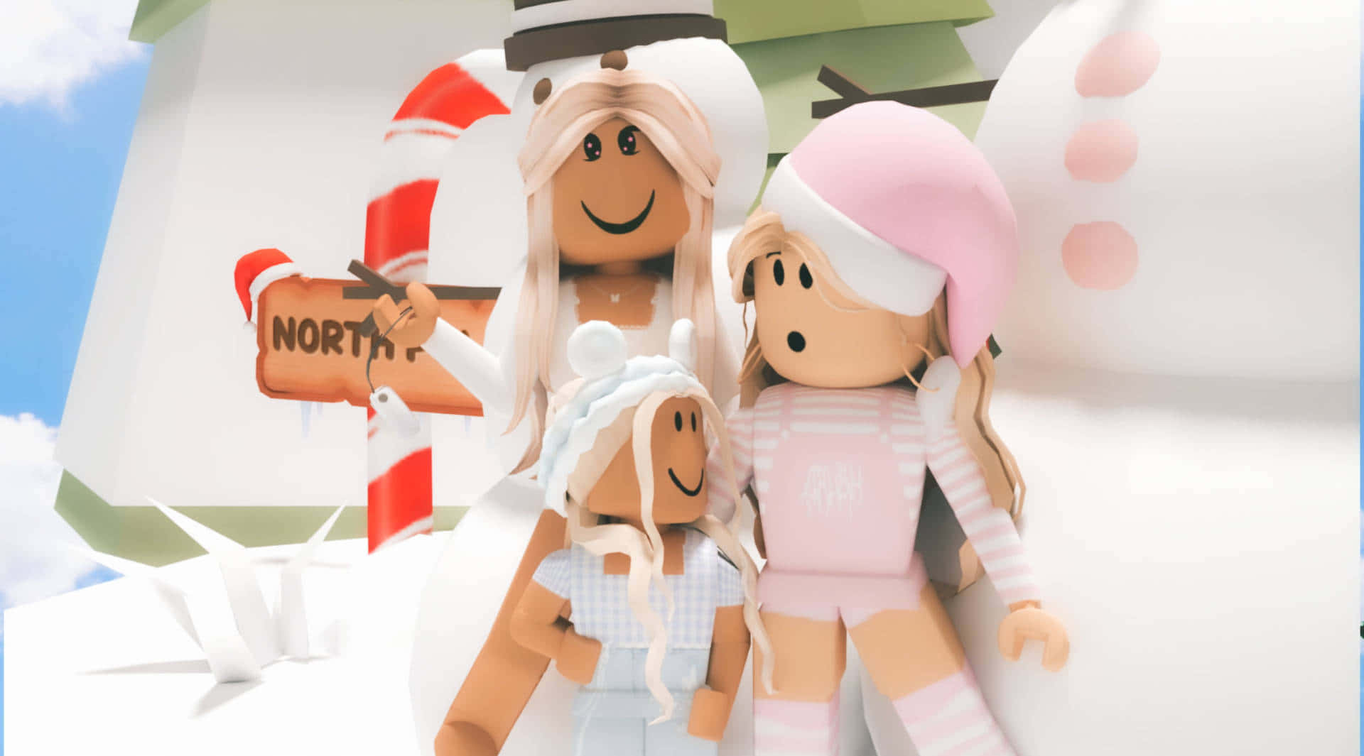 Winter 桌布 壁紙 — 三個穿著冬季服裝的愉快Roblox頭像站在一個巨大的雪人旁邊，雪人拿著一個寫著「NORTH」的拐杖糖標誌，在明亮的藍天下。