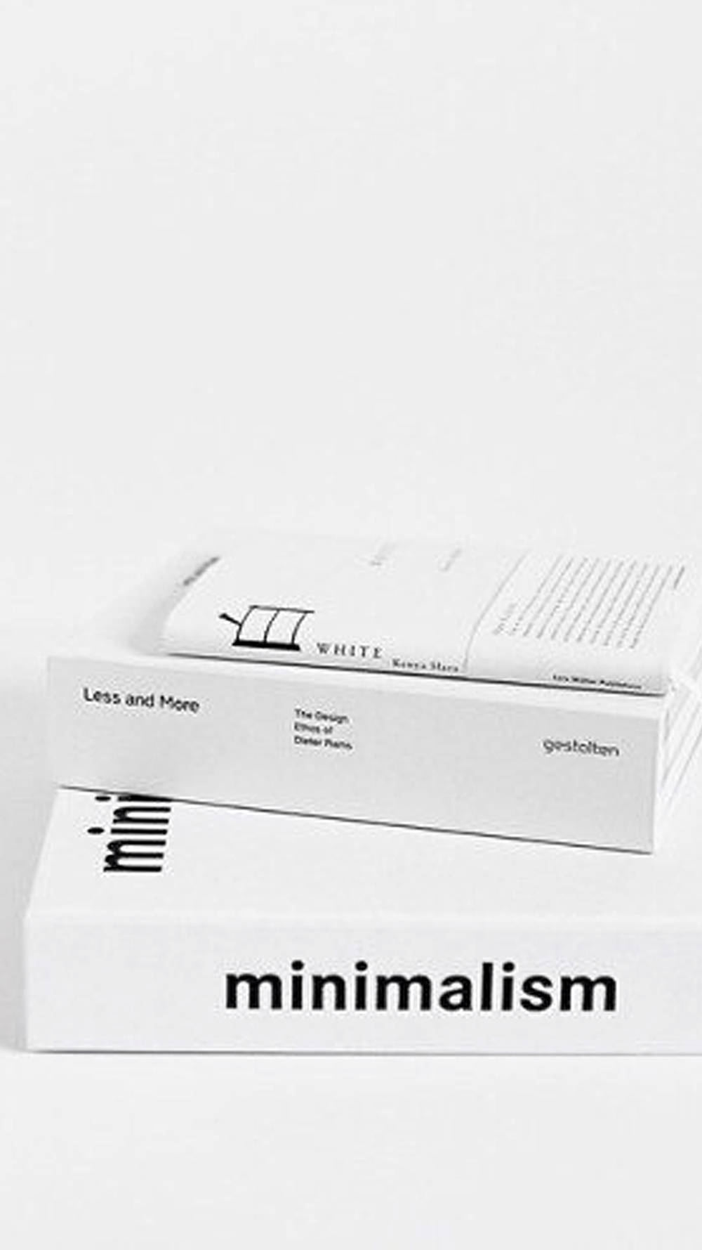 White Aesthetic iPhone 桌布 壁紙 — 三本極簡白色書籍堆疊，帶有粗體黑色字體，背景為純白色。
