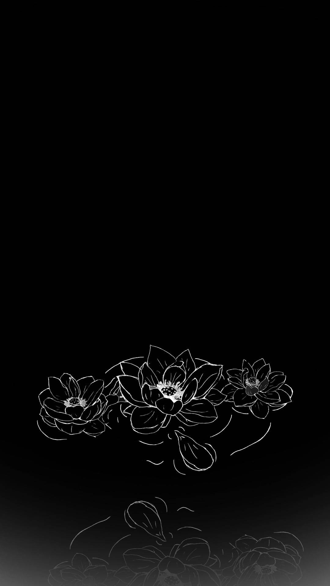 Flowers 桌布 壁紙 — 三朵白色輪廓蓮花漂浮在黑色漸變背景上，下方有模糊的花卉剪影。