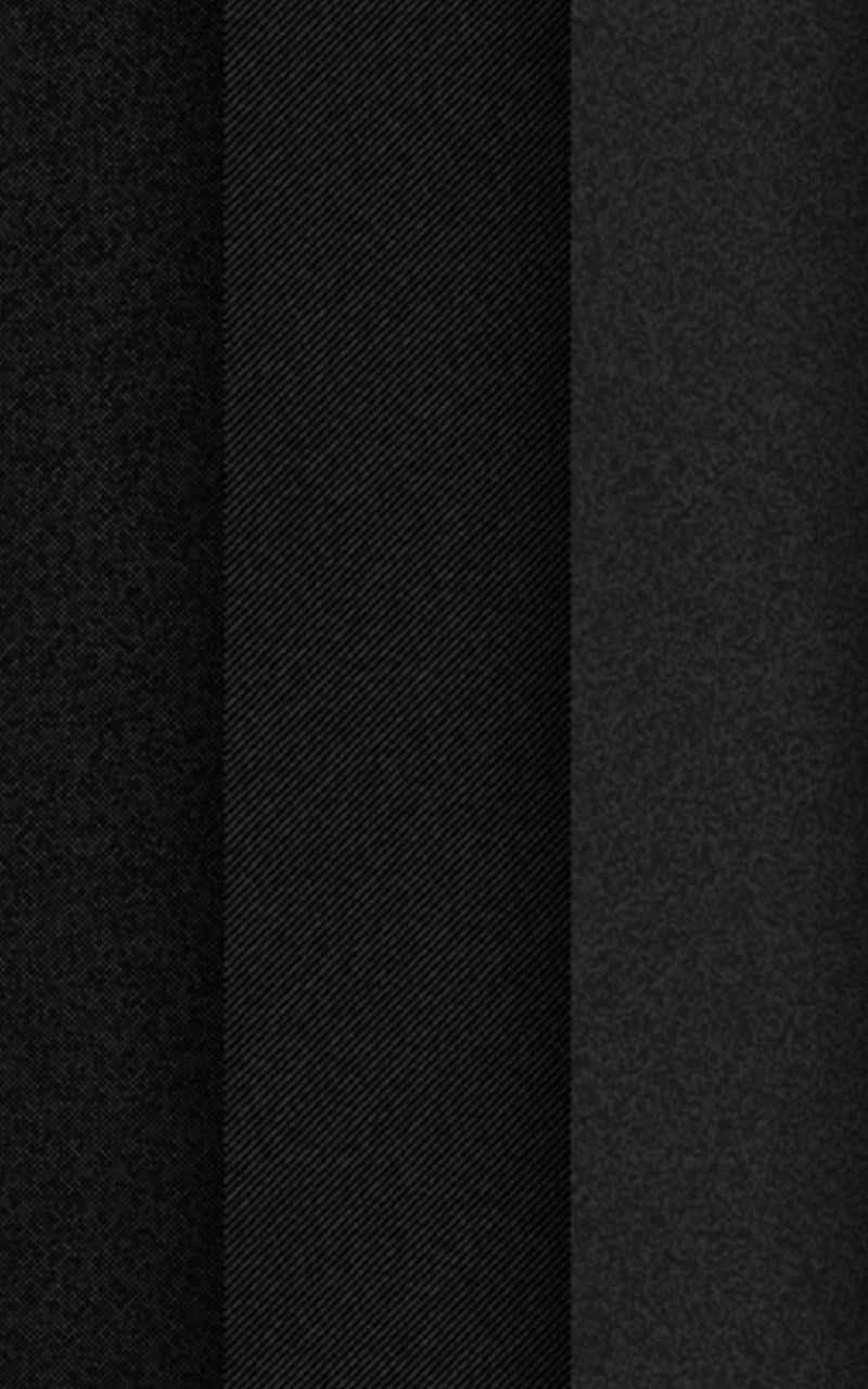 800x1280 桌布 壁紙 — 三條垂直黑色布料條紋，具有多種質感和微妙的色調差異。