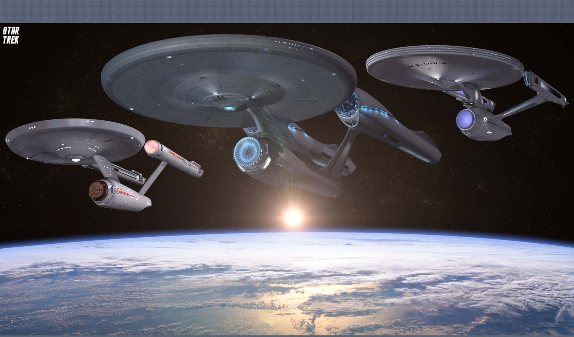 星際爭霸戰 桌布 壁紙 — 三艘星際爭霸戰星艦在行星雲層覆蓋的表面上方翱翔，明亮的太陽在地平線上升起。
