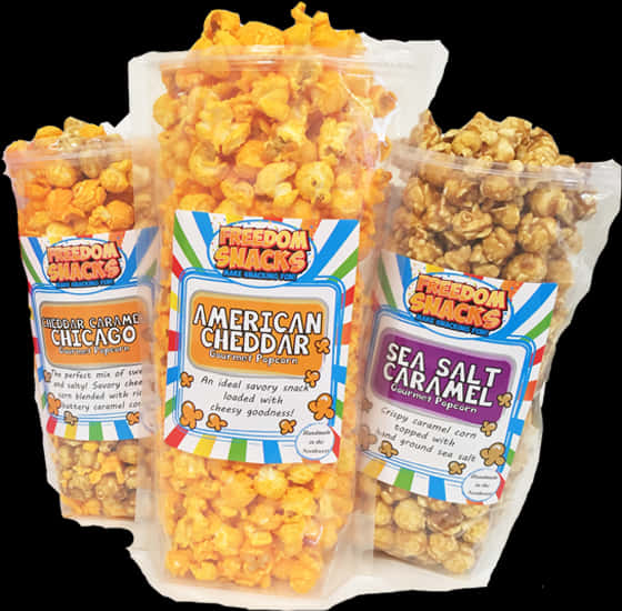 Product 桌布 壁紙 — 三袋 Freedom Snacks 美食爆米花，口味包括 American Cheddar Sea Salt Caramel 和 Cheddar Caramel Chicago，在黑色背景前展示。