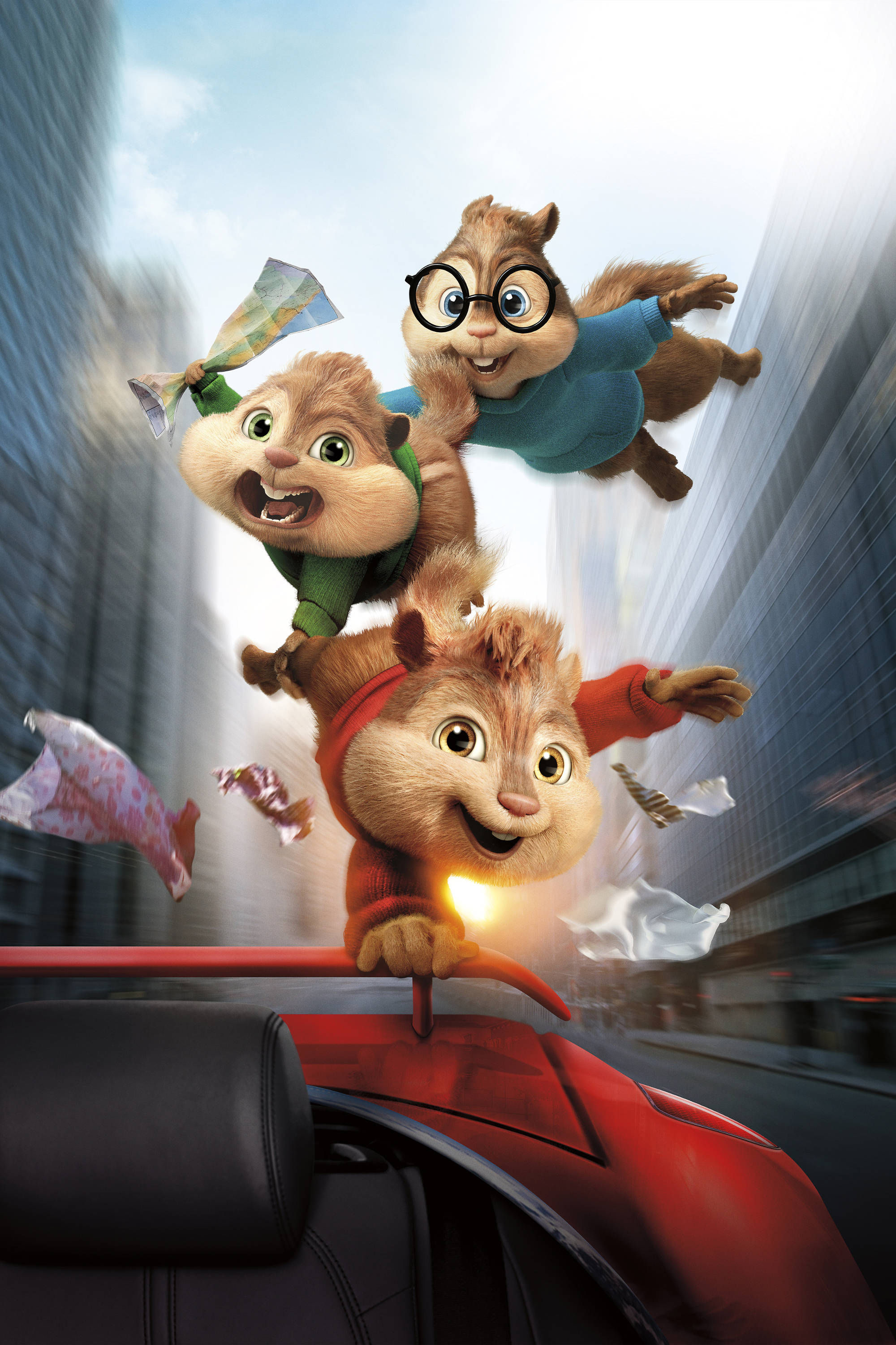 Chipmunks 桌布 壁紙 — 三隻動畫花栗鼠快樂地騎在一輛疾馳的紅色敞篷車上，穿過模糊的城市景觀。