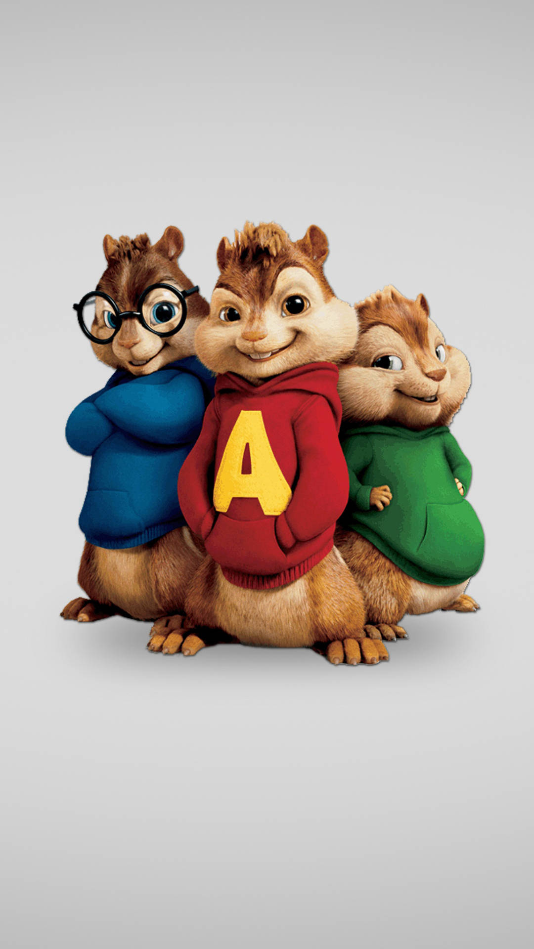 Chipmunks 桌布 壁紙 — 三隻動畫花栗鼠穿著彩色連帽衫，在純灰色背景前愉快地擺姿勢。