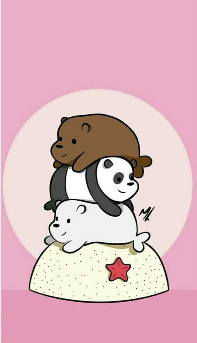 Cute Cartoon Characters 桌布 壁紙 — 三隻卡通熊在一個飾有星星的枕頭上頑皮地疊在一起，背景是柔和的粉紅色。