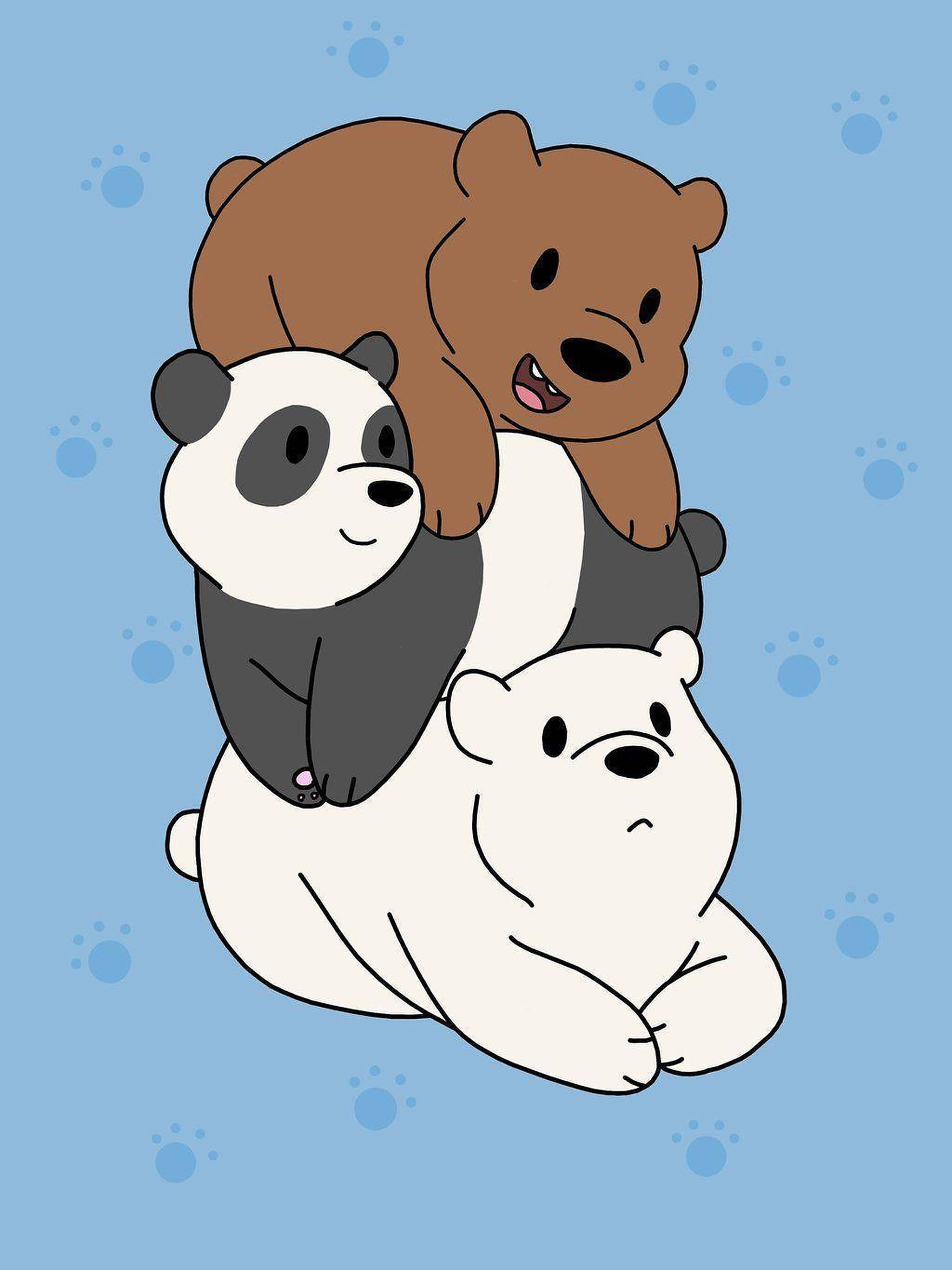 三隻小熊 桌布 壁紙 — 三隻卡通熊在淺藍色背景上頑皮地疊在一起，周圍散落著爪印。