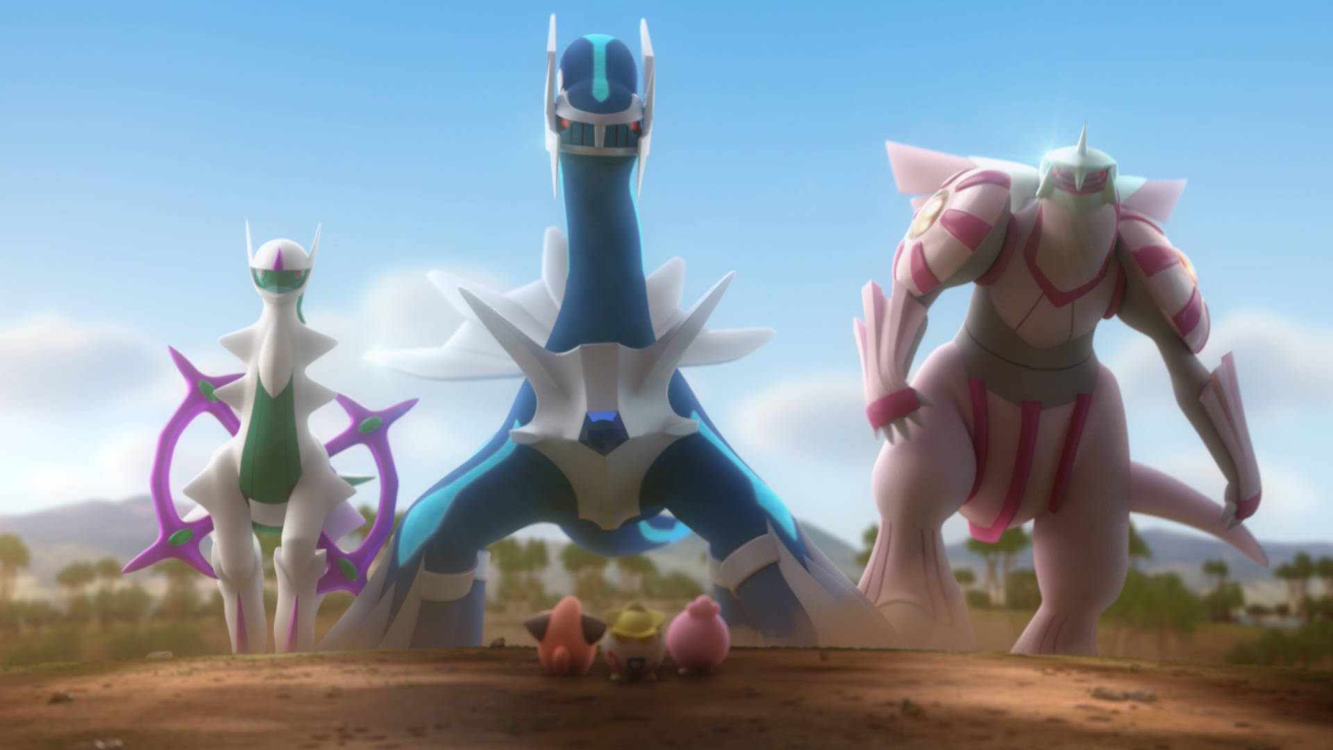 Dialga 桌布 壁紙 — 三隻雄偉的寶可夢在沙漠景觀中高高聳立，三隻小寶可夢在牠們腳下，天空清澈湛藍。