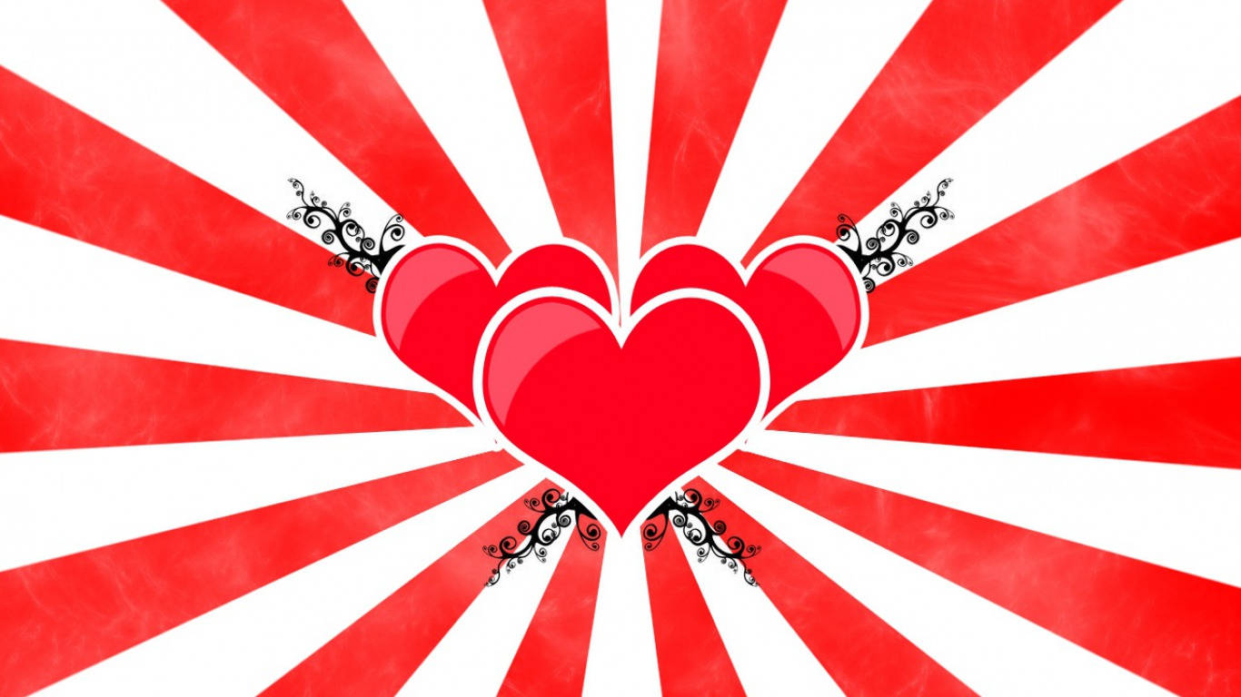 愛心 桌布 壁紙 — 三顆光滑的紅色心臟在鮮明的紅白條紋背景上向外放射，帶有黑色華麗裝飾。