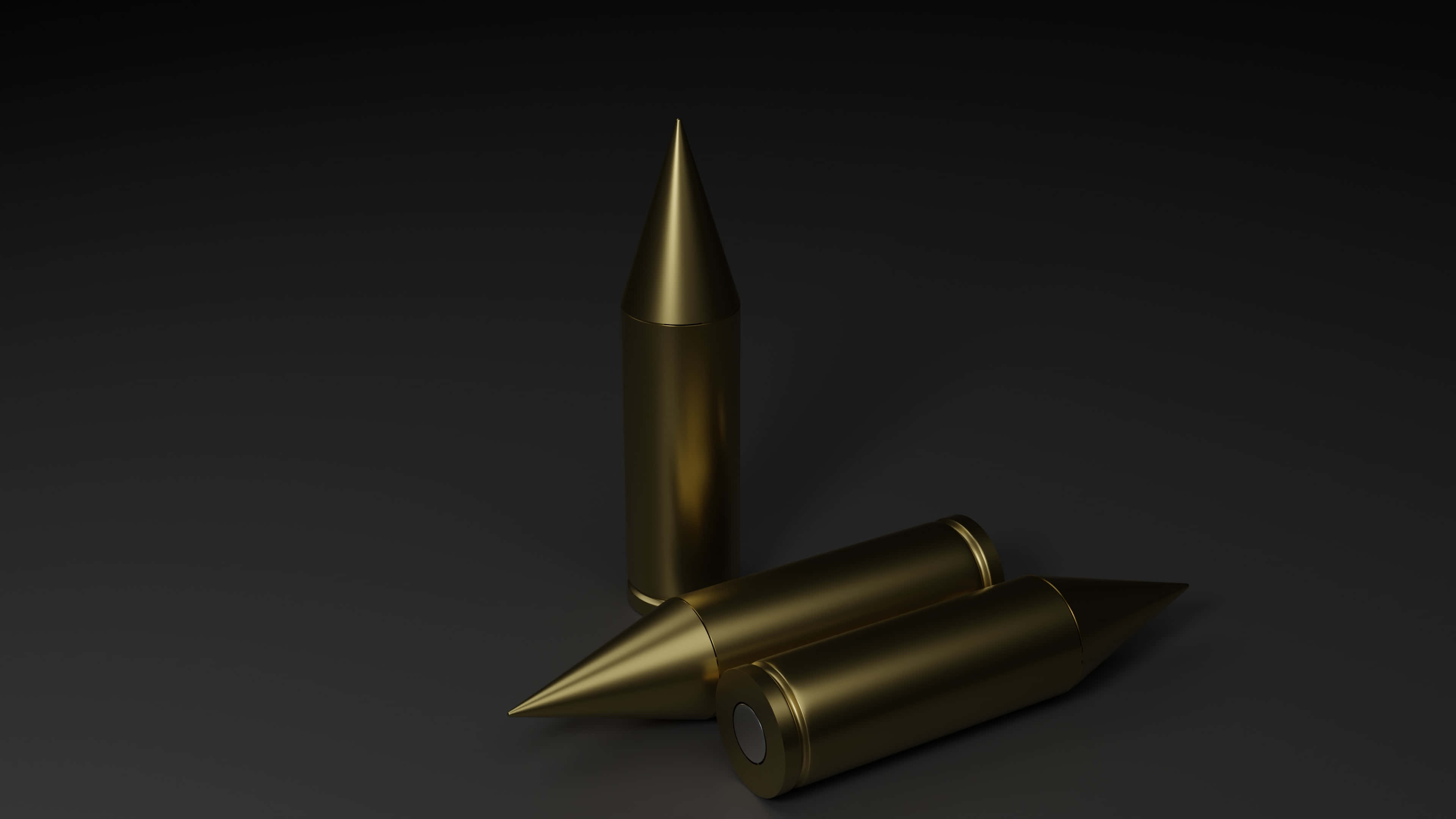 bullet 桌布 壁紙 — 三顆金色子彈放置在深色漸變表面上，戲劇性的燈光凸顯了它們的金屬光澤。