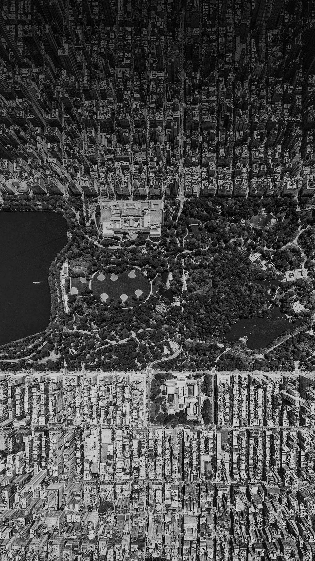 Black And White iPhone 桌布 壁紙 — 中央公園被密集的曼哈頓摩天大樓和棋盤式街道包圍的黑白空拍視圖。