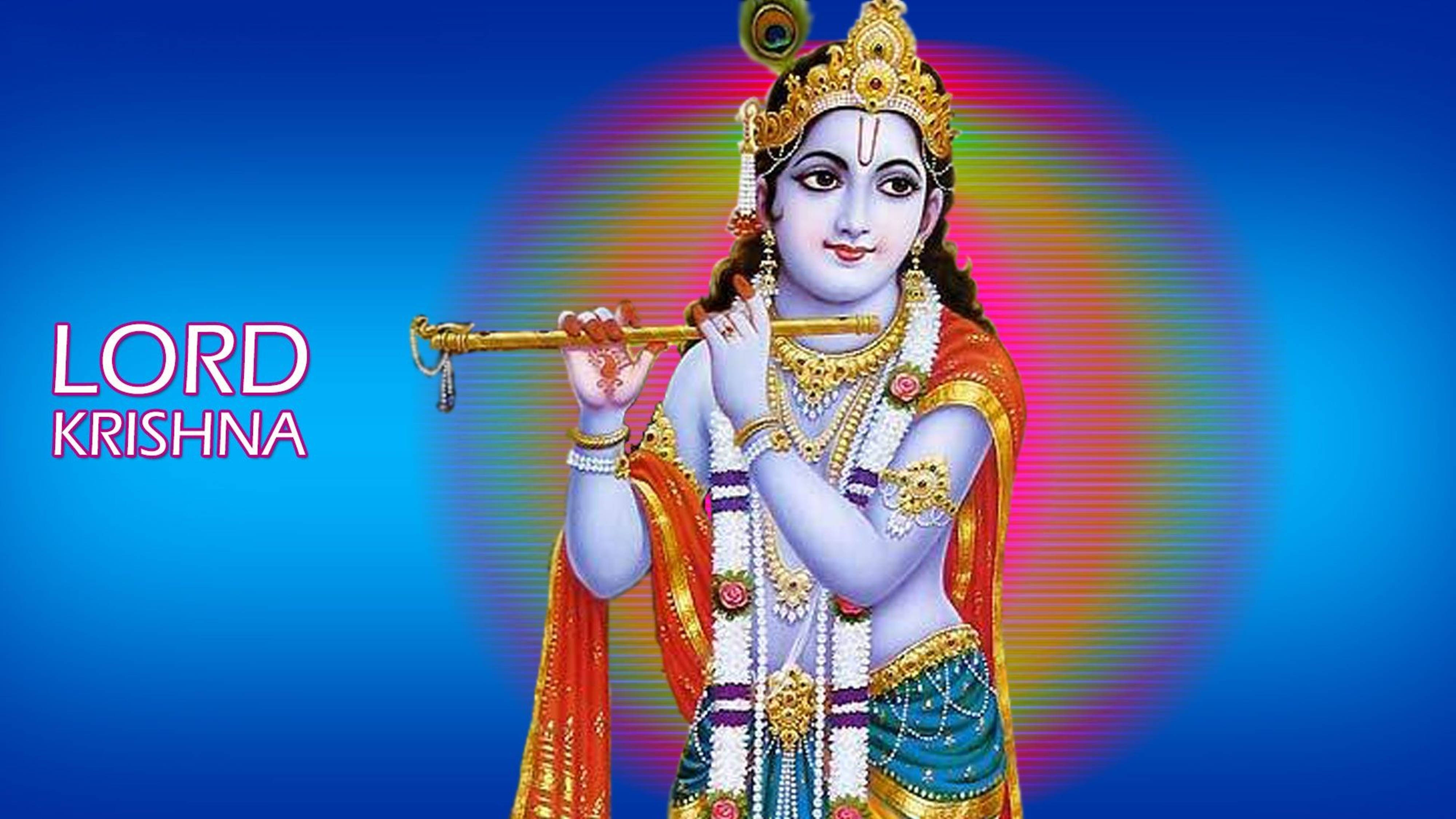 krishna god 桌布 壁紙 — 主克里希納在燦爛的藍色背景前吹奏金色長笛，帶有彩色光環。