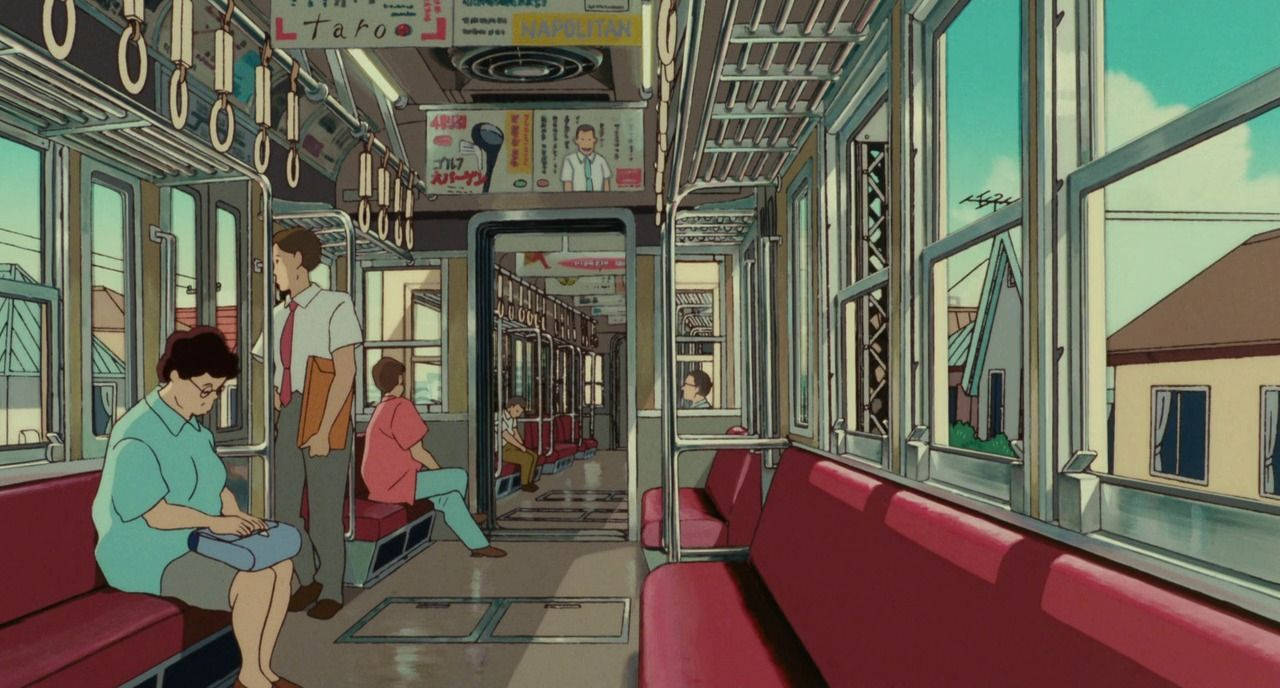 桌布 壁紙 — 乘客乘坐一輛陽光明媚的復古火車車廂，配有紅色座椅和日語標誌，穿過安靜的住宅區。