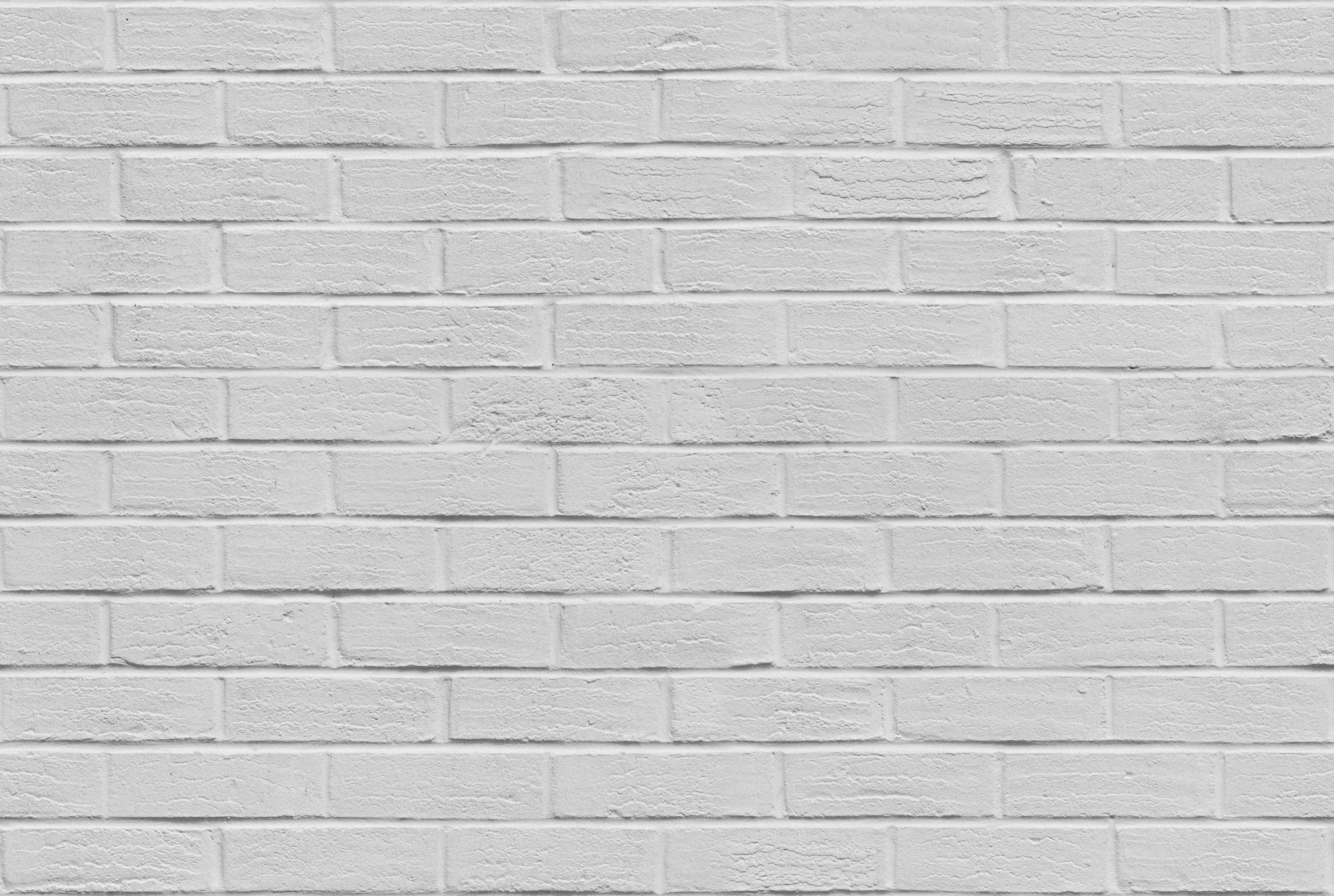 White Brick 桌布 壁紙 — 乾淨的白色磚牆，在均勻照明下帶有細微紋理和砂漿線。