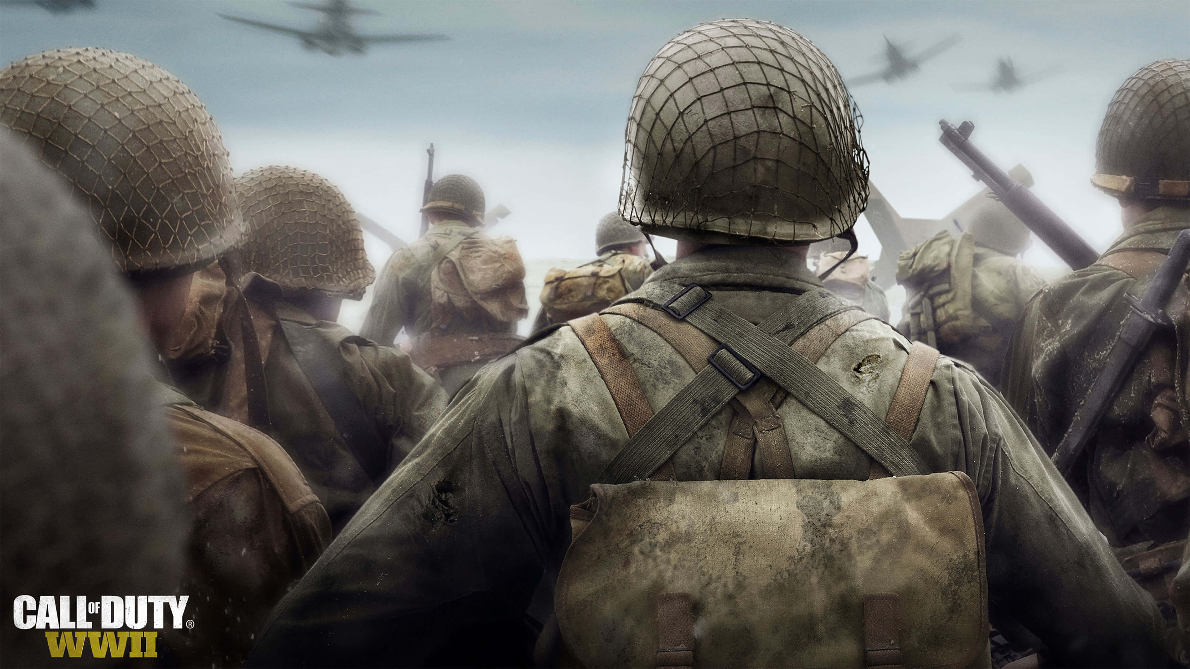 games 桌布 壁紙 — 二戰頭盔士兵向前行進，戰鬥機在頭頂飛過，呈現 gritty 戰場場景。