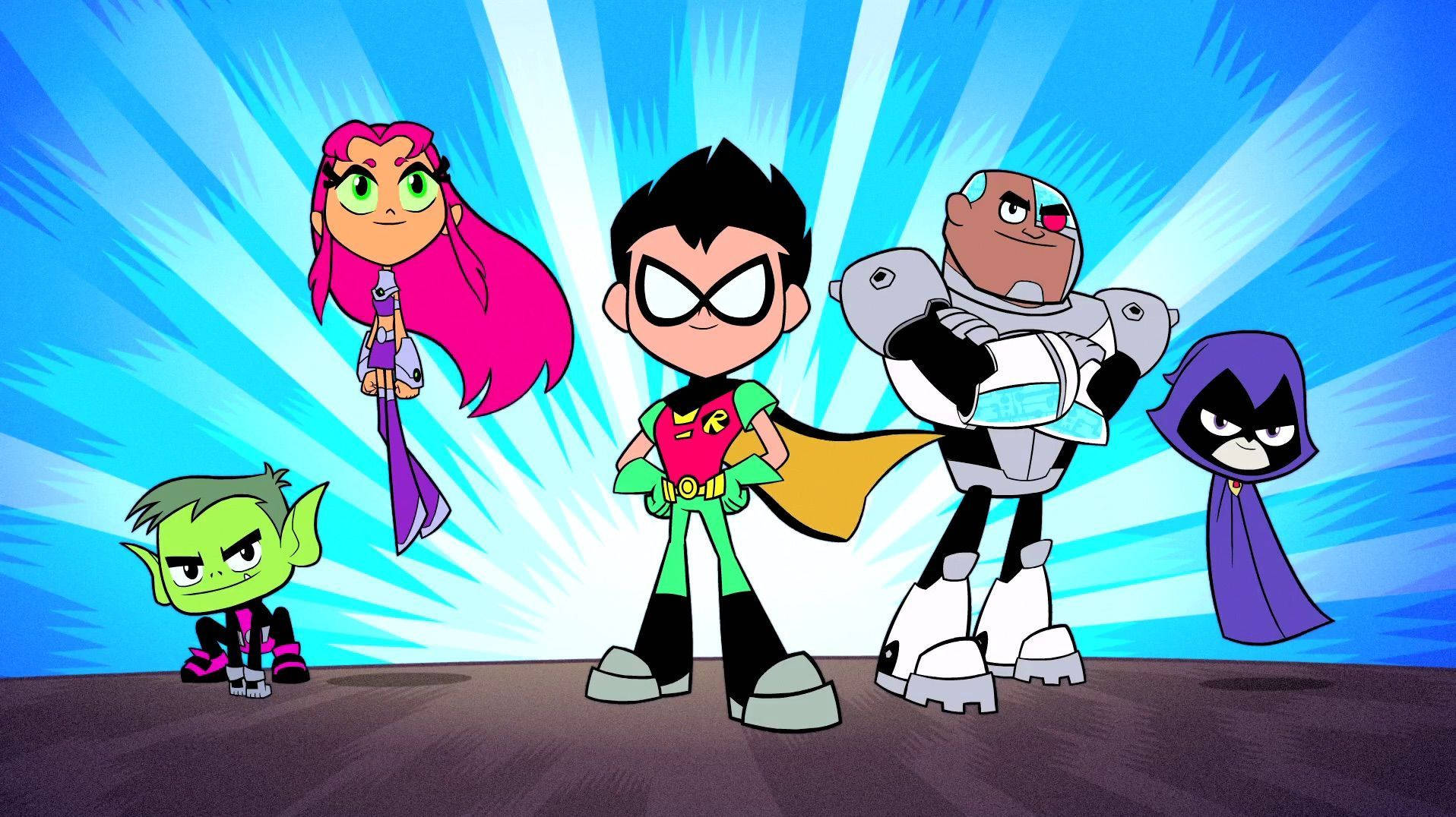 teen titans go 桌布 壁紙 — 五位動畫青少年超級英雄自信地站在充滿活力的藍色放射背景前。