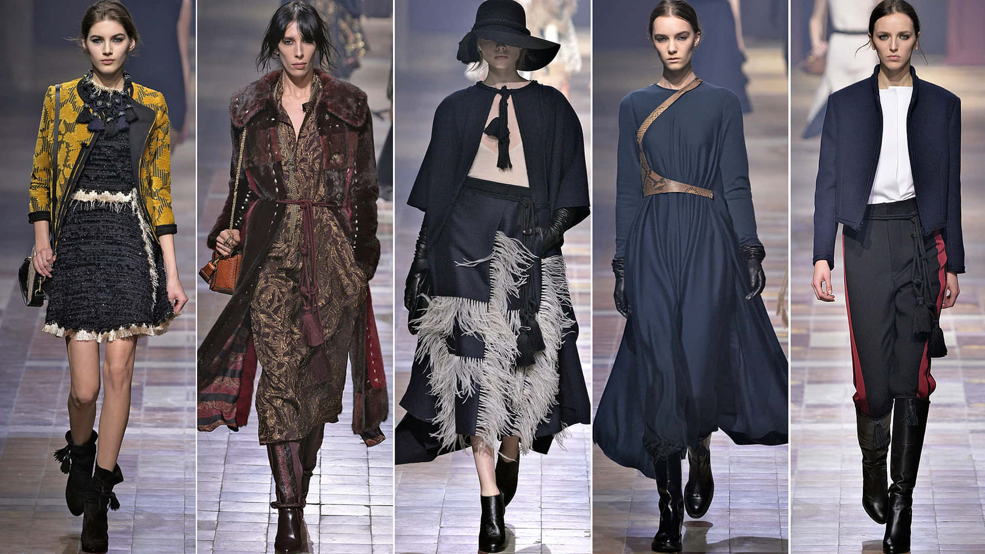 Runway 桌布 壁紙 — 五位模特兒自信地走過伸展台，在明亮的舞台燈光下展示前衛時尚，包括大膽的質感、豐富的面料和戲劇性的輪廓。