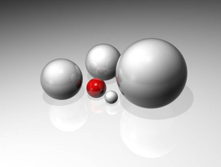 Red And White 桌布 壁紙 — 五個不同大小的金屬球體，其中一個鮮紅色球體位於它們之間，放置在反光表面上。