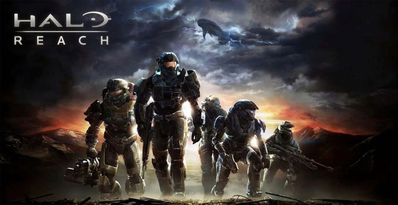 Halo Red Team 桌布 壁紙 — 五名裝甲士兵站在戲劇性的日落景觀中，一艘巨大的外星飛船在暴風雨的天空中隱現。