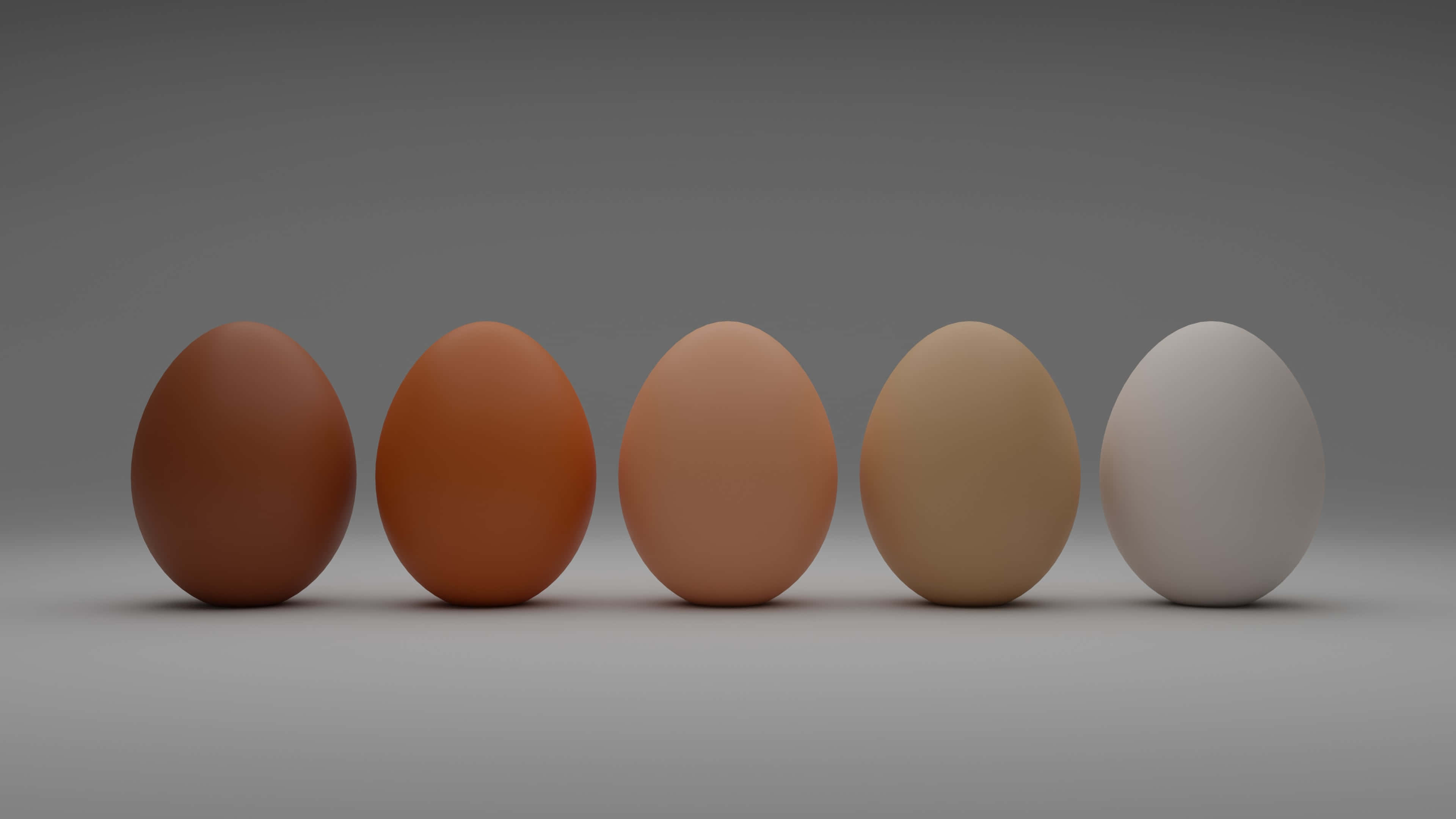 Brown Eggs 桌布 壁紙 — 五顆雞蛋，從深棕色到淺白色的漸變色調，排列成一排，放在中性灰色表面上。