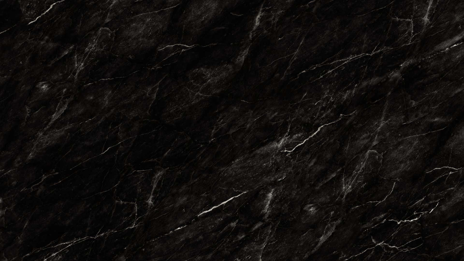 Black Desktop 桌布 壁紙 — 亮面黑色大理石的近距離特寫，帶有複雜的白色紋理，營造出奢華精緻的質感。