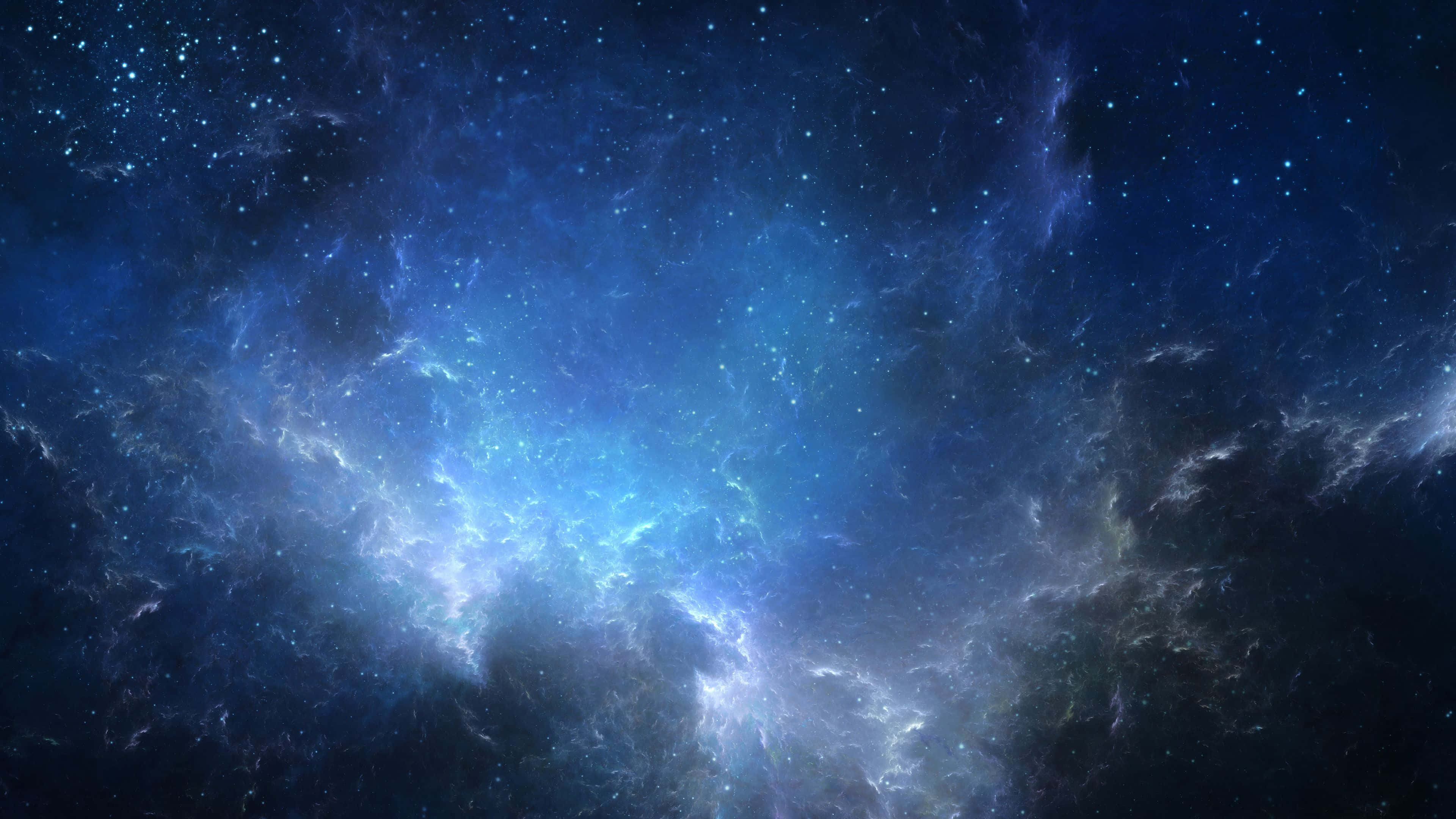 4K 太空 桌布 壁紙 — 令人嘆為觀止的宇宙星雲景觀，在繁星點綴的黑暗天空中散發出充滿活力的藍色和白色光芒。