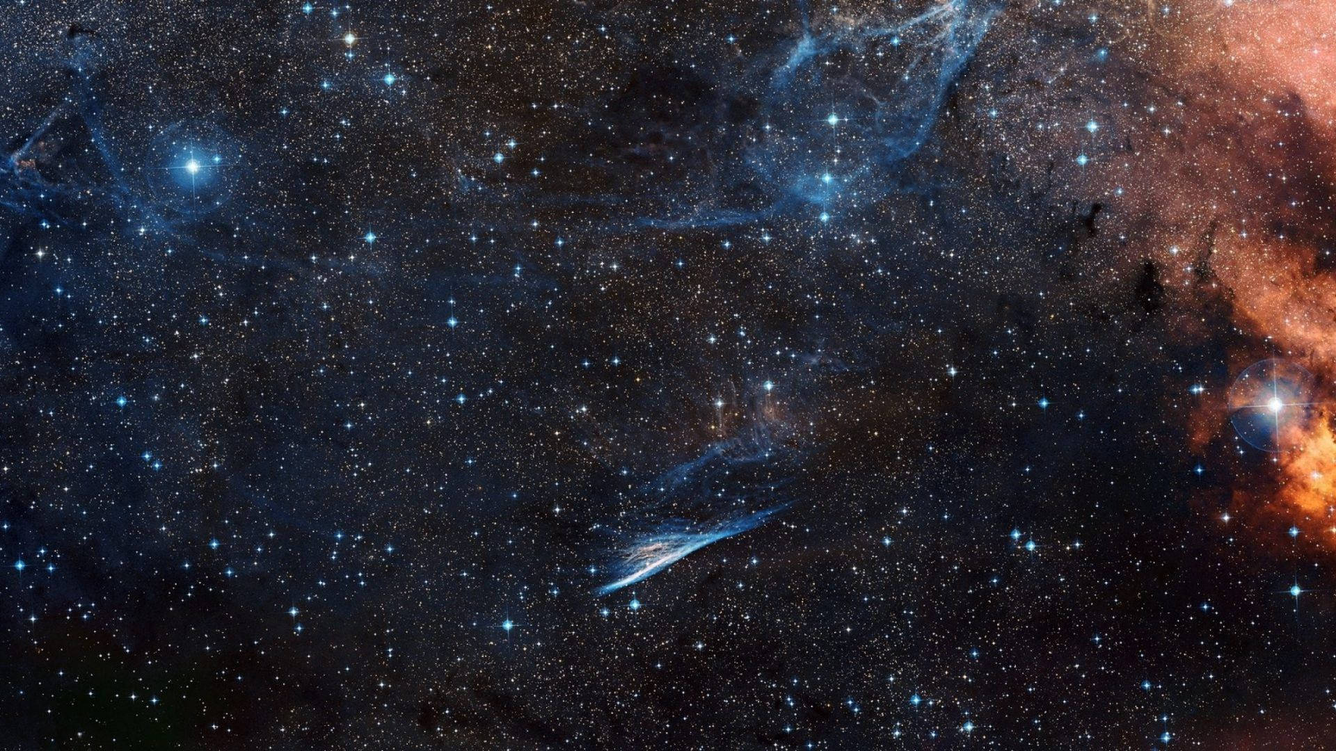 外太空 桌布 壁紙 — 令人嘆為觀止的宇宙星雲景觀，發光的藍色和橙色雲團在無數閃爍的星星中旋轉。