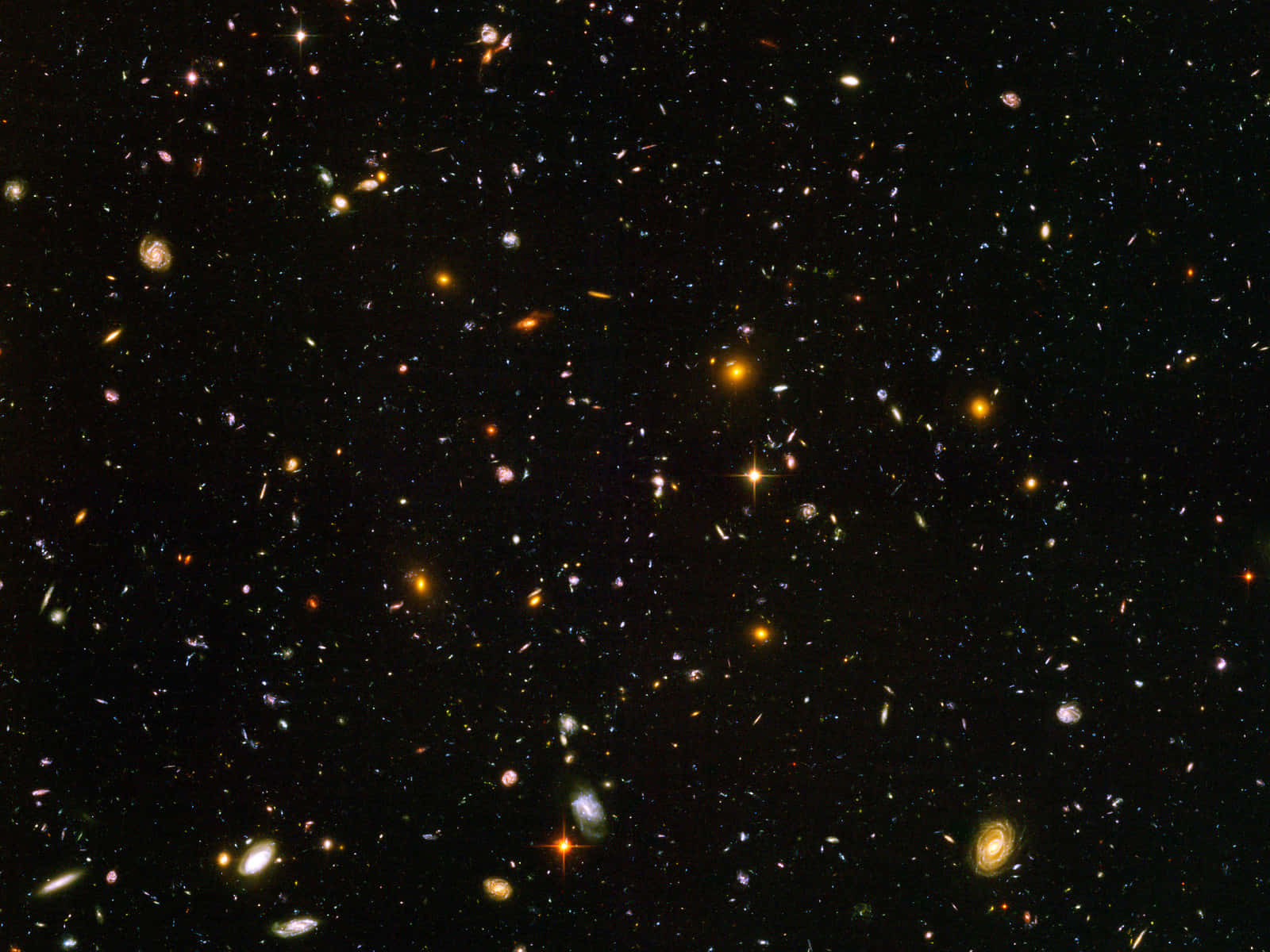 Deep Space 桌布 壁紙 — 令人嘆為觀止的景色，無數星系和恆星散落在深邃的黑色宇宙中。