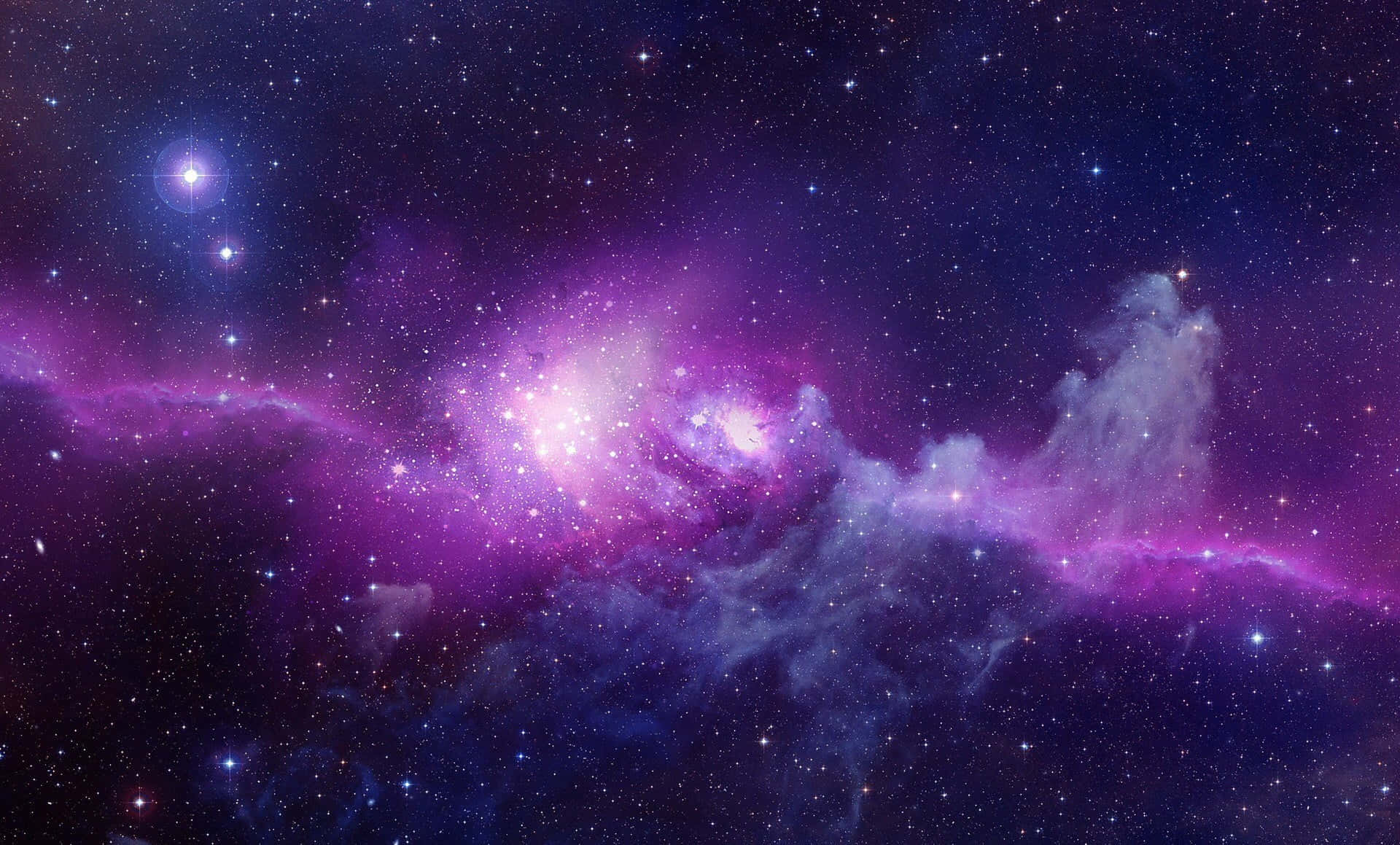 Purple Desktop 桌布 壁紙 — 令人嘆為觀止的景象，一個充滿活力的紫色和藍色星雲，在深邃的宇宙天空中閃爍著星星。