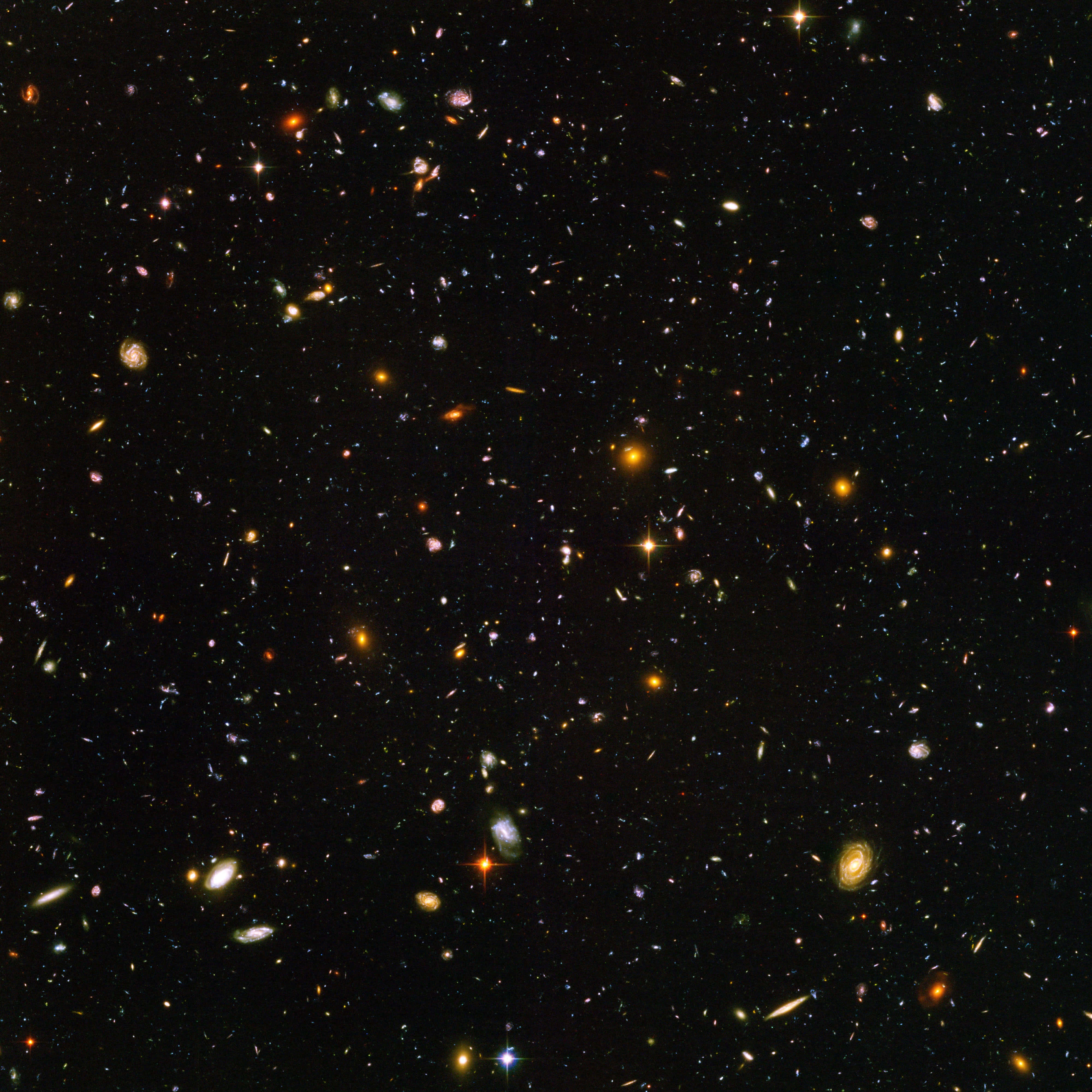 桌布 壁紙 — 令人嘆為觀止的深空景觀，充滿無數星系和恆星，在宇宙虛空中閃耀著鮮豔的色彩。