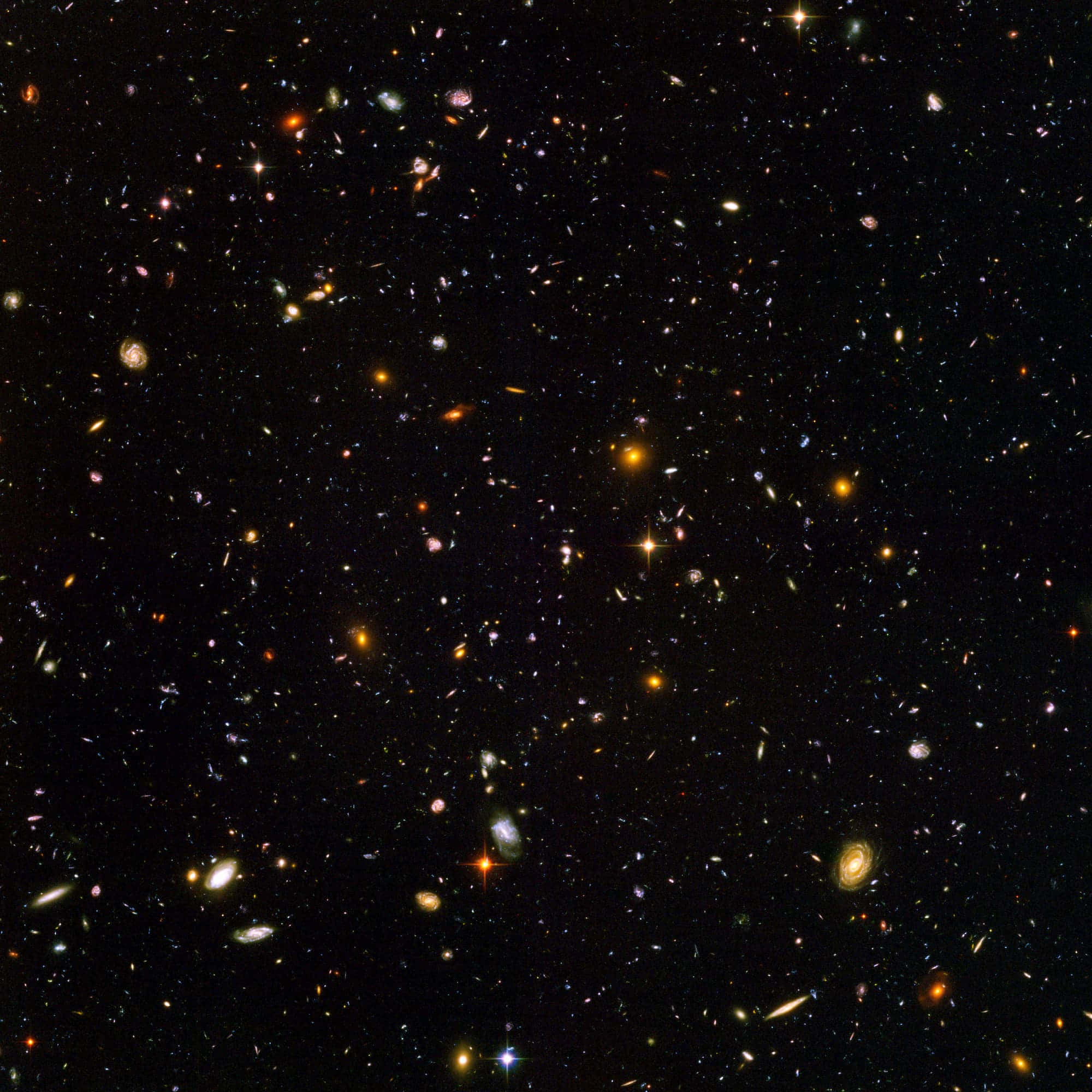 太空 桌布 壁紙 — 令人嘆為觀止的深空景觀，充滿無數星系和恆星，在宇宙虛空中閃耀著鮮豔的色彩。