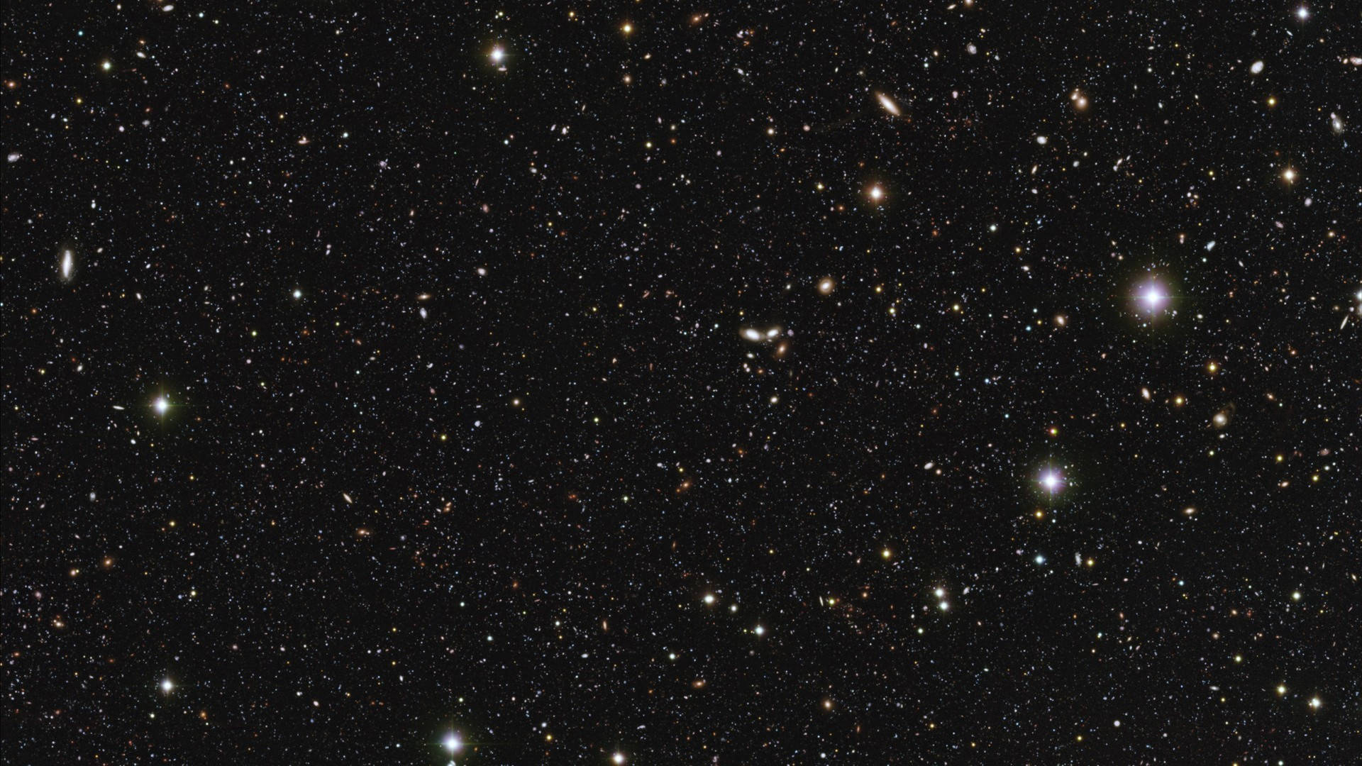 Space Pc 桌布 壁紙 — 令人嘆為觀止的深空景觀，充滿無數恆星和遙遠星系，在黑色虛空中閃耀。