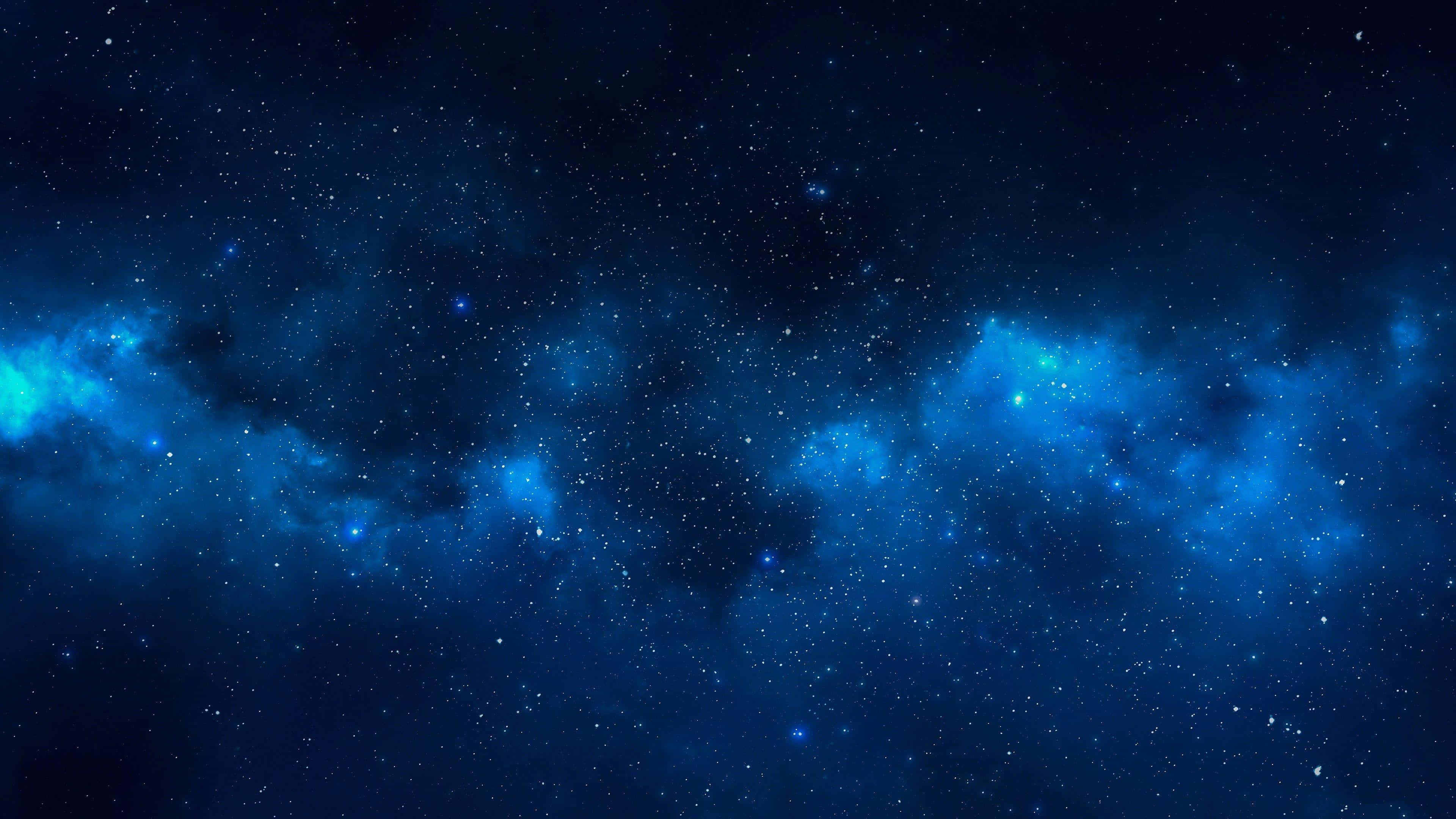 太空美學動圖 桌布 壁紙 — 令人嘆為觀止的深藍色宇宙空間，充滿了發光的星雲和無數閃爍的星星。