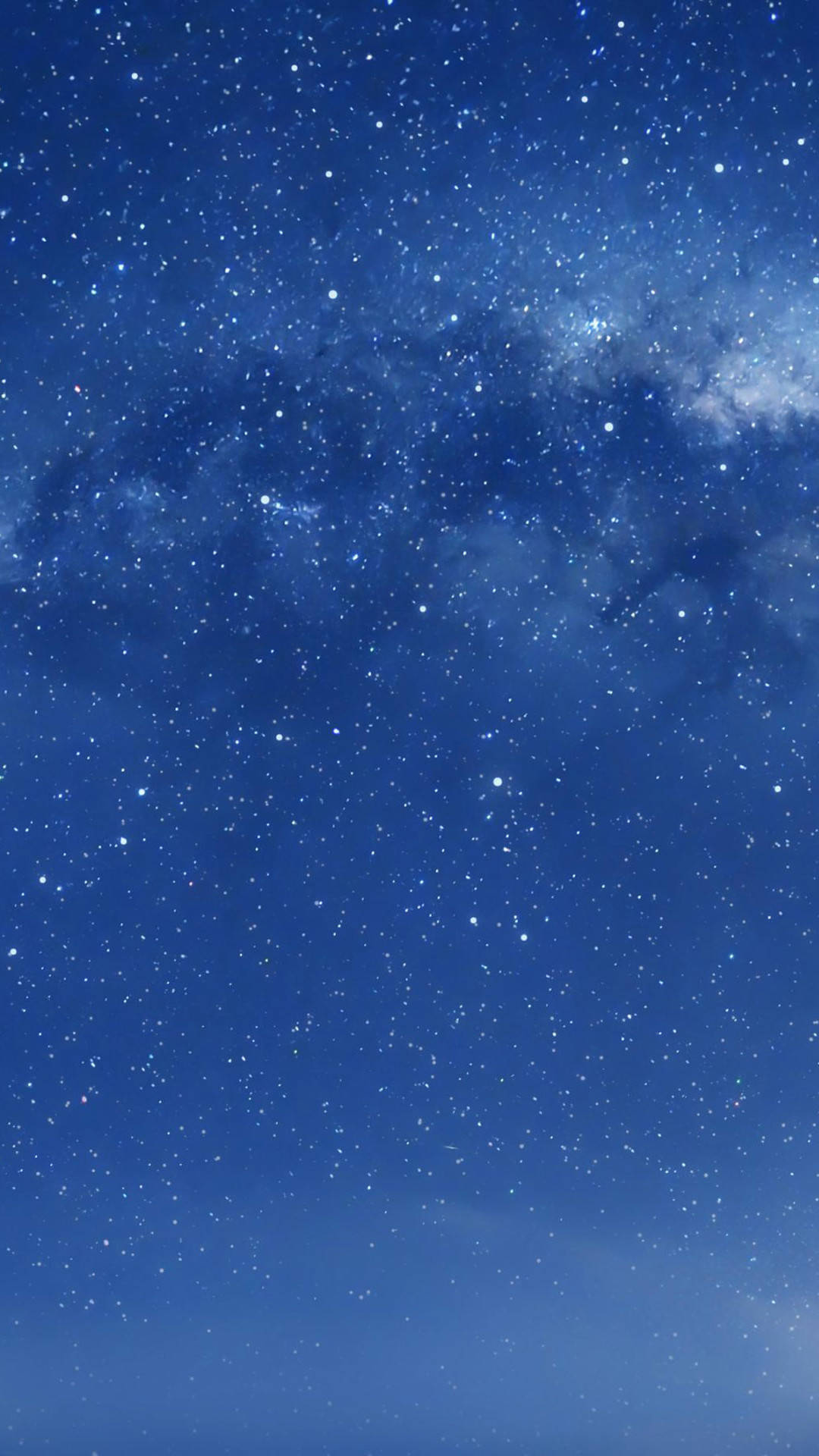iOS 8 桌布 壁紙 — 令人嘆為觀止的銀河系景觀，在深藍色夜空中閃爍著無數星星。