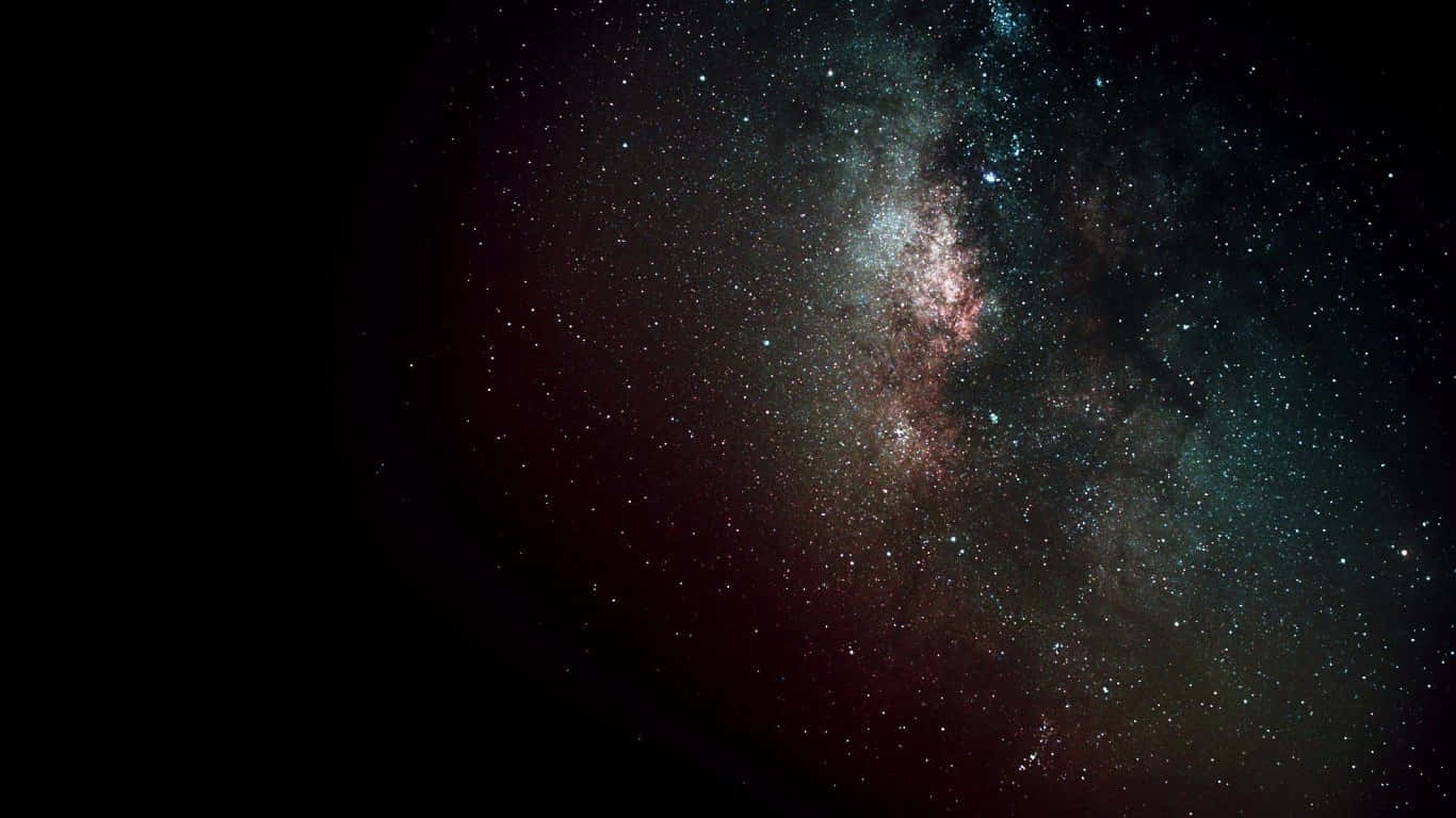 Black Galaxy 桌布 壁紙 — 令人嘆為觀止的銀河系景觀，在深邃的黑色宇宙背景下，粉紅色和藍綠色的星雲閃閃發光。