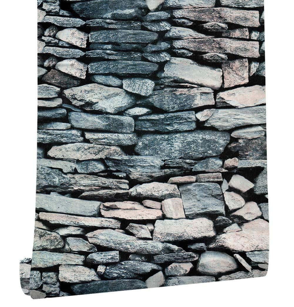 Rocks 桌布 壁紙 — 以不均勻圖案堆疊的各種灰色和柔和粉紅色岩石組成的粗獷石牆特寫。