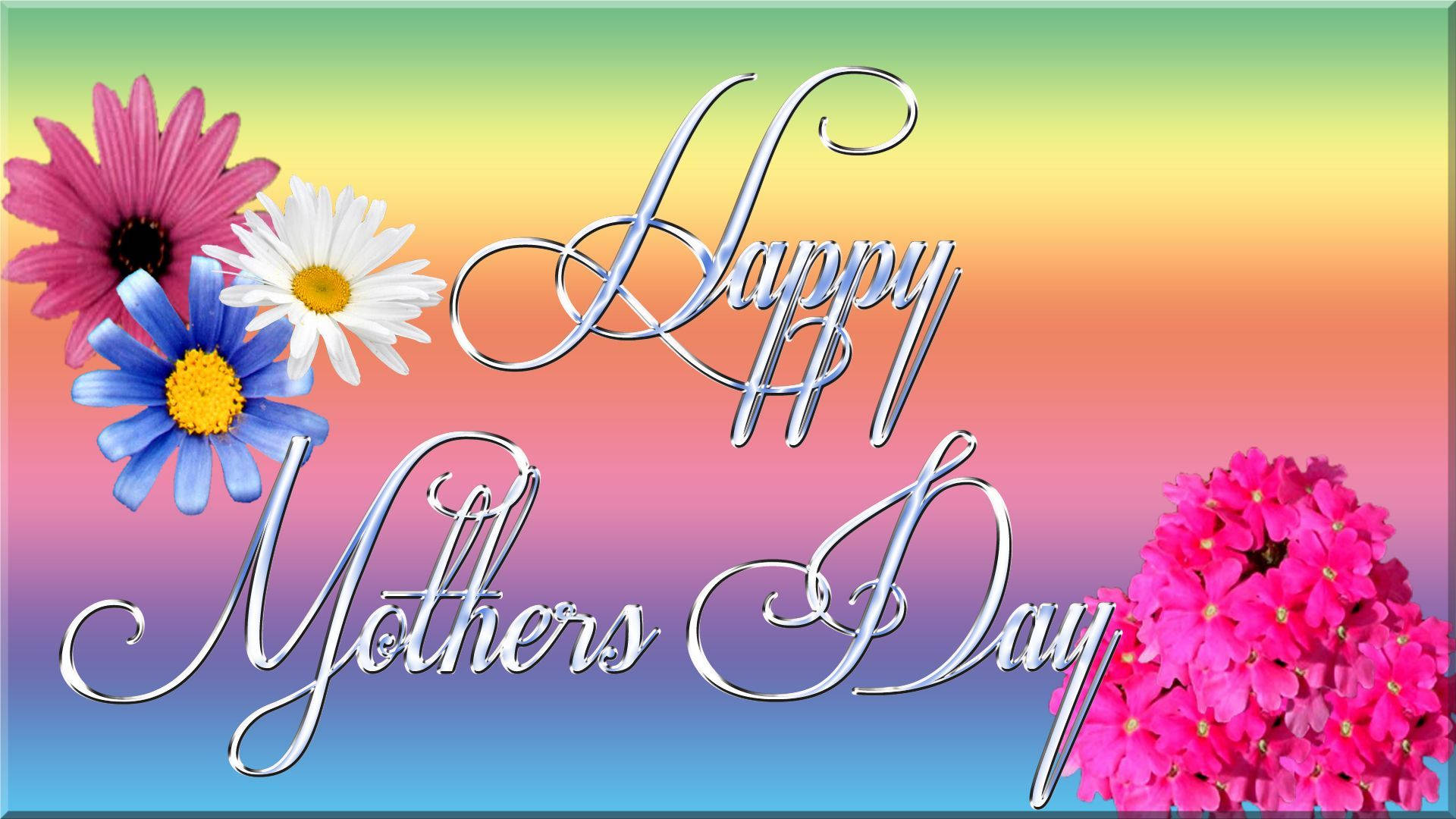 Mothers Day 桌布 壁紙 — 以銀色手寫字體呈現的母親節快樂文字，周圍環繞著色彩繽紛的花朵，背景為彩虹漸變色。