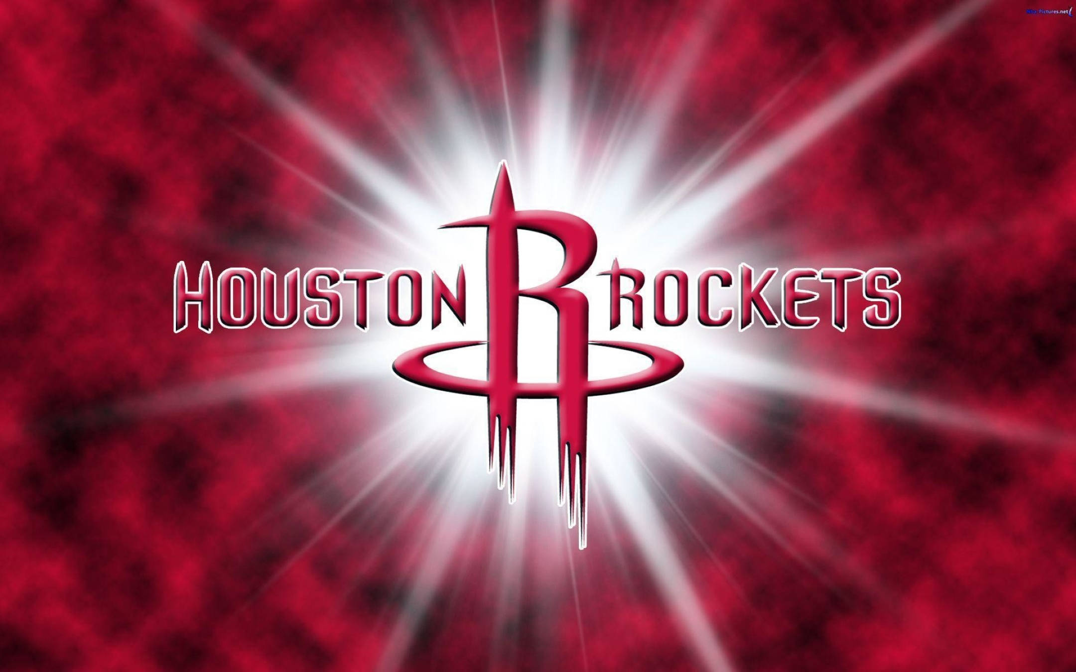 Houston Rockets 桌布 壁紙 — 休士頓火箭隊標誌在帶有紋理的紅色背景上散發出明亮的白色光束。